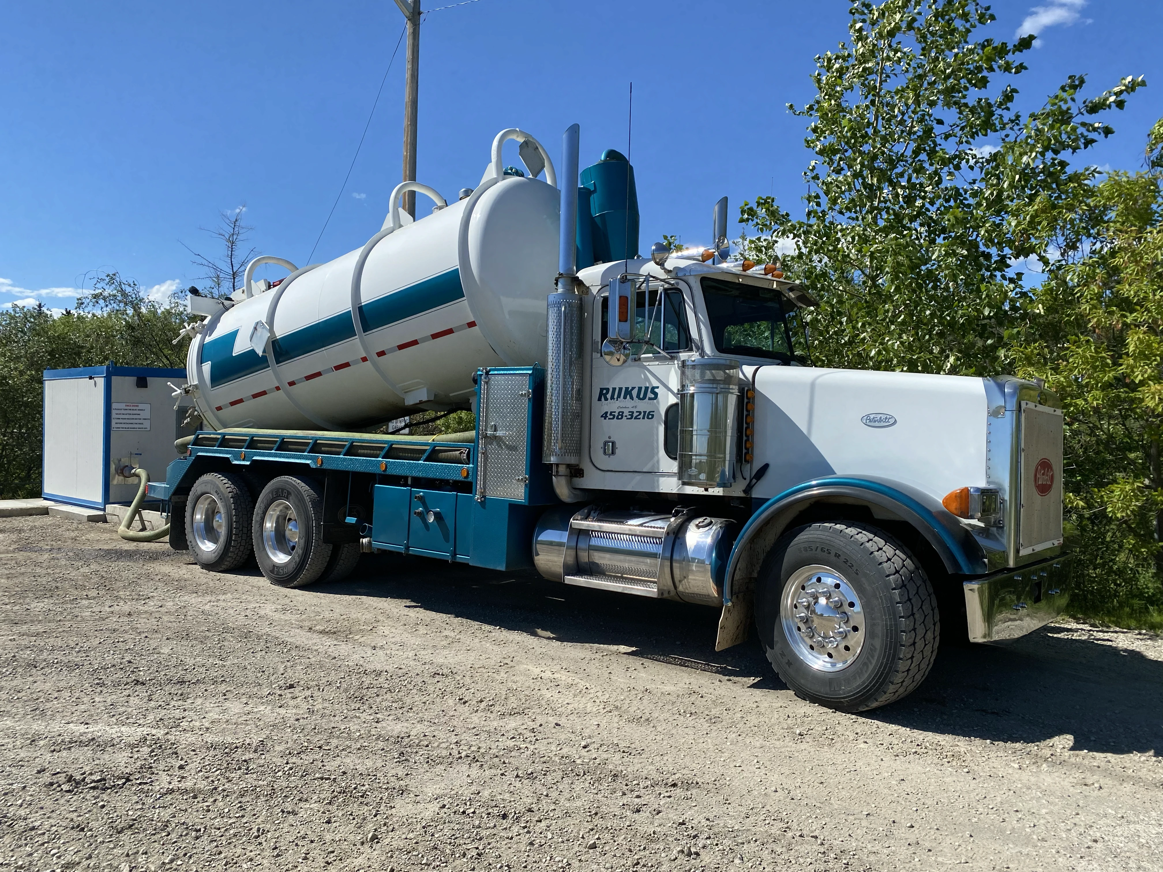 Vacuum truck from Rukus Liquid Waste Removal hauling septic and liquid waste near Edmonton, Alberta, for residential and commercial clients.