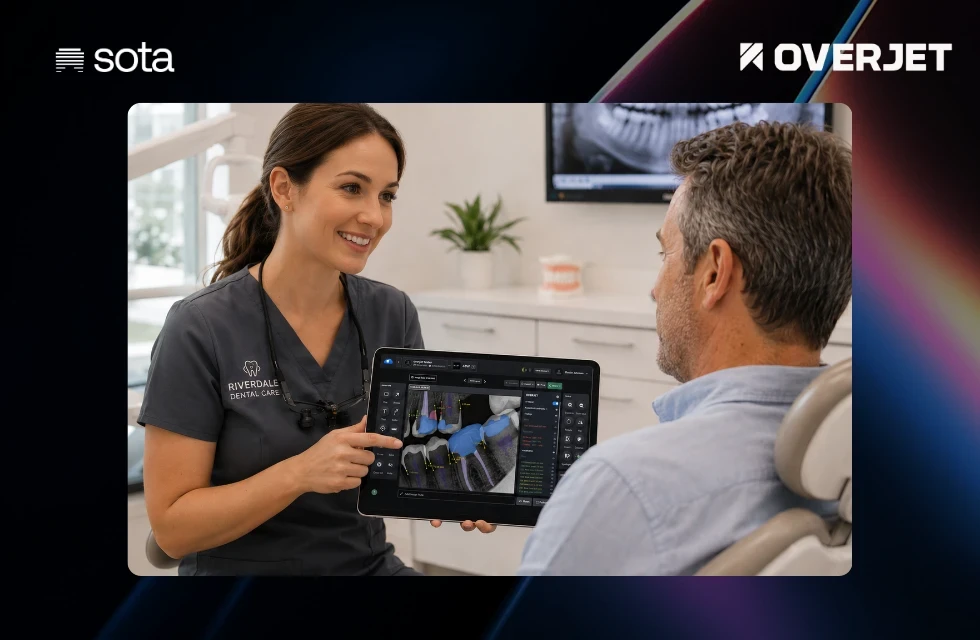 Dentist showing SOTA Cloud imaging to patient