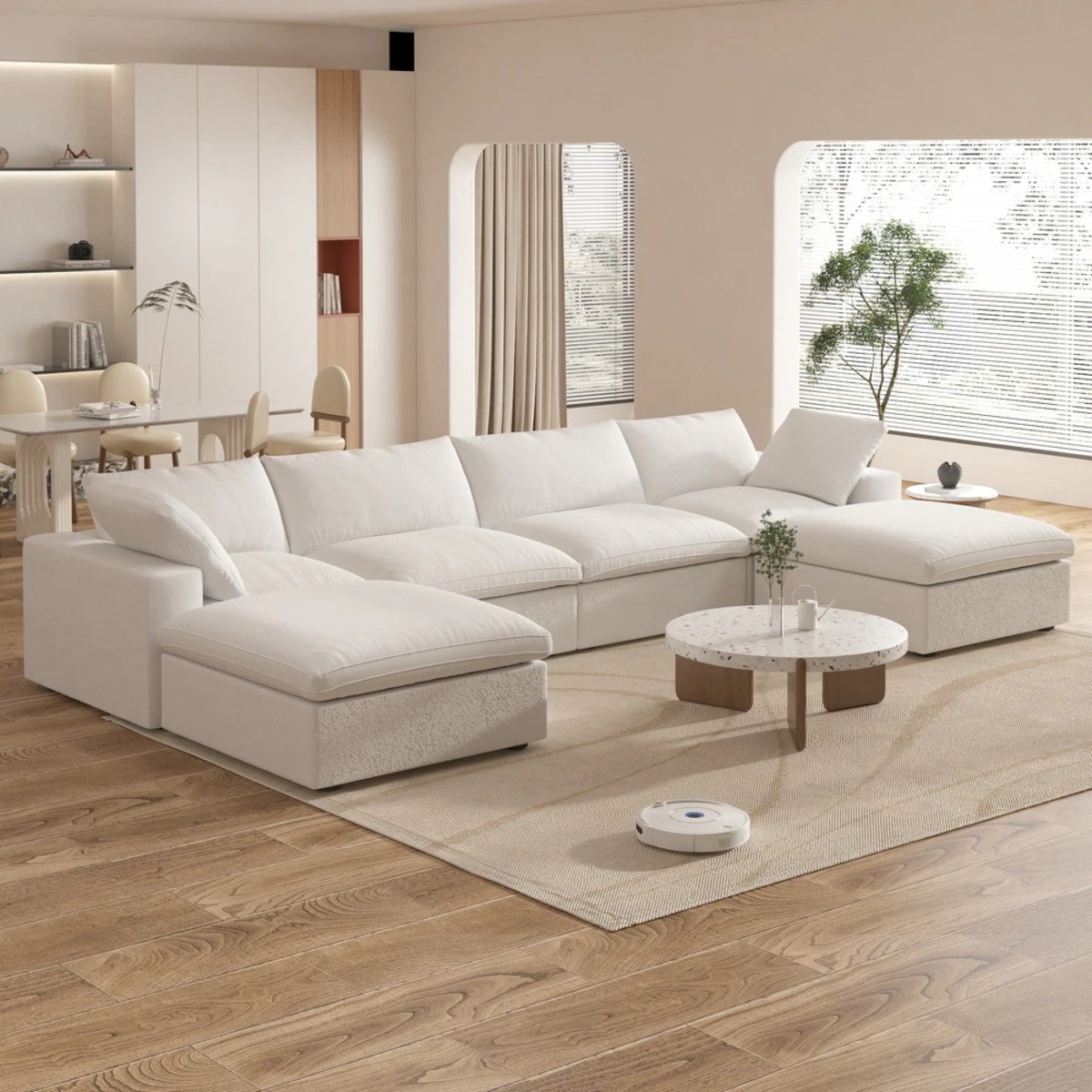 Bed Bath & Beyond down-filled white sectional sofa with ottoman in a modern living room with minimalist decor