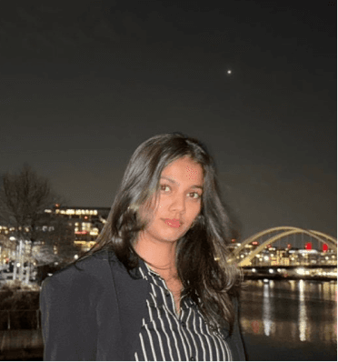 Man standing in front of a speeding train in a metro subway station.