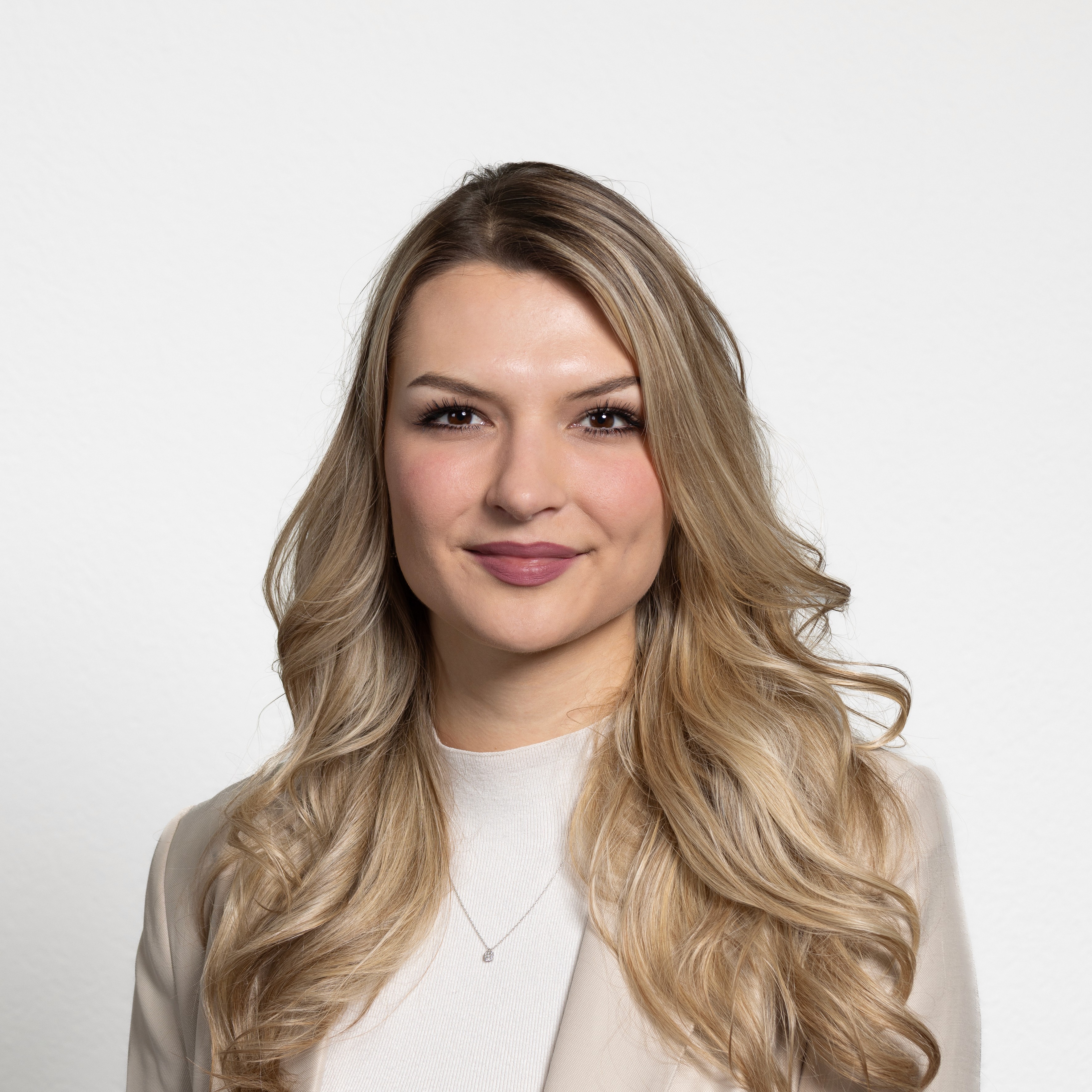 woman in white crew neck shirt smiling