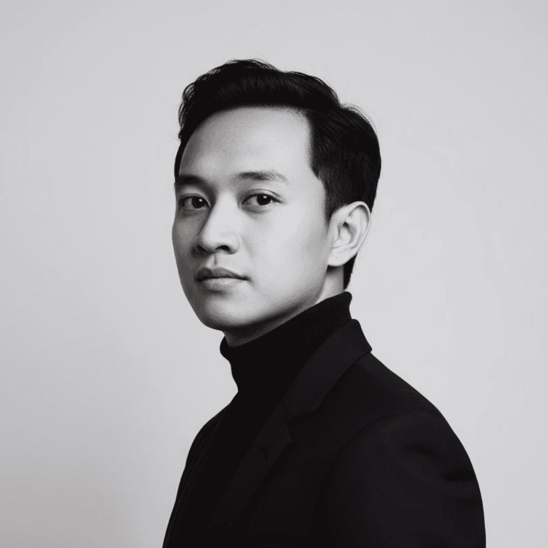 Profile portrait of a man in a grey shirt