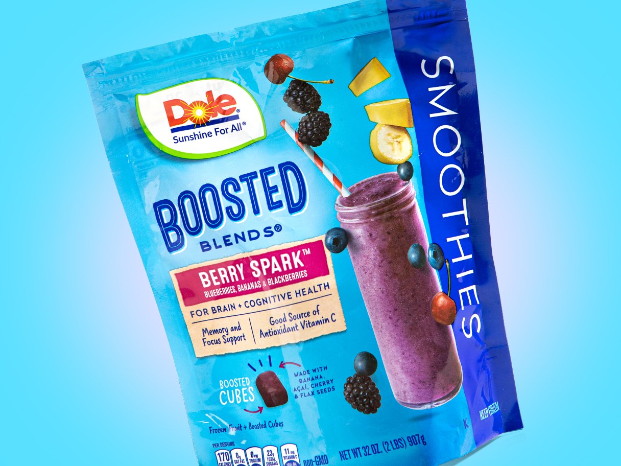 Rooftops of a coastal town with the sea in background