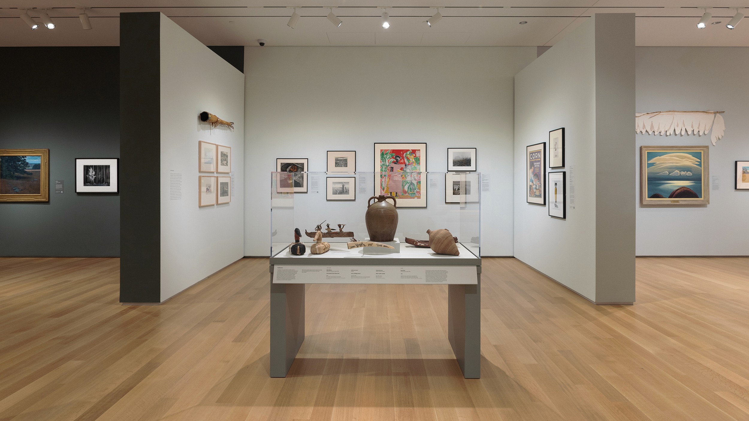 A person stands in a sandstone cave.