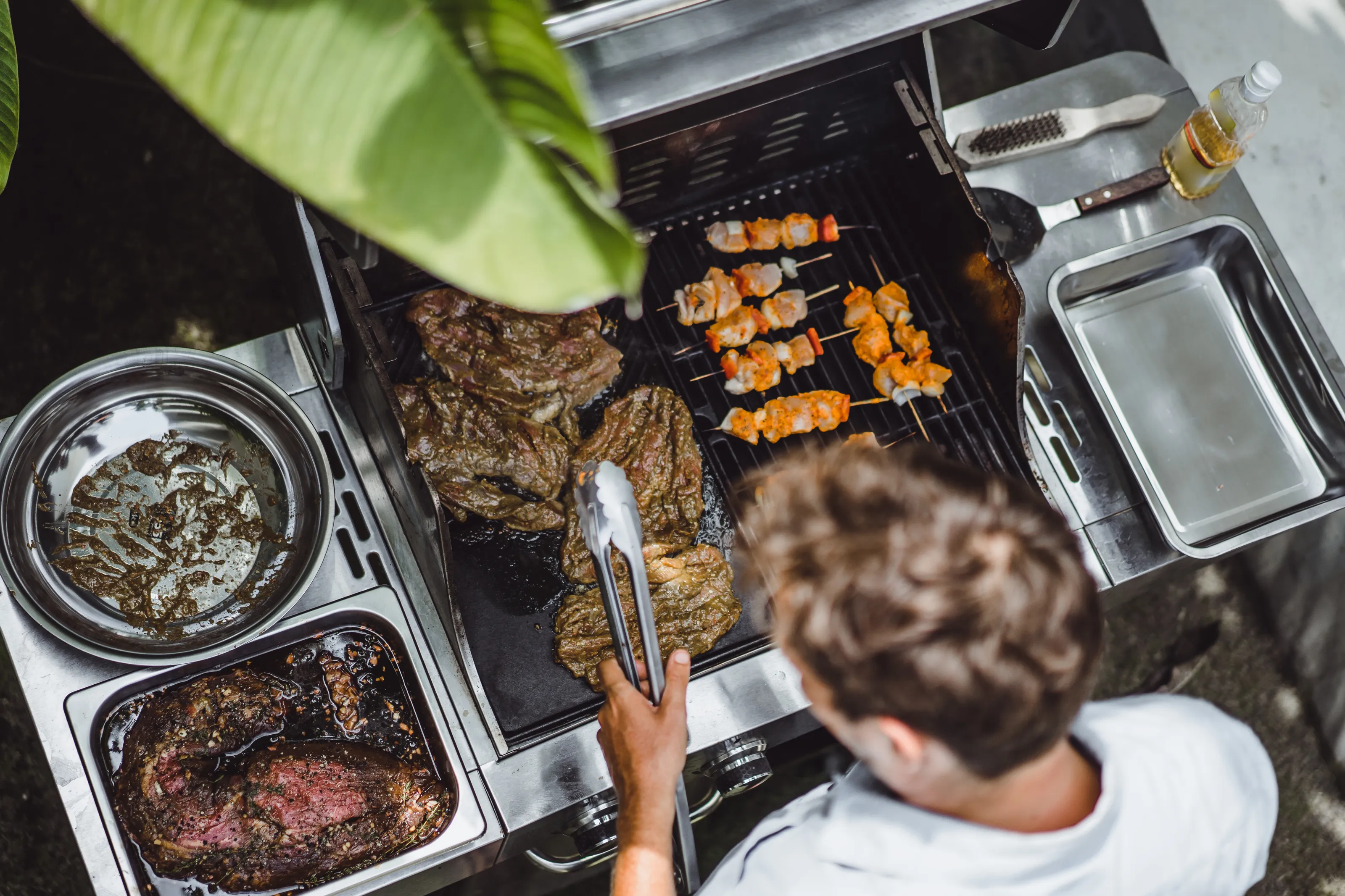 Resident grilling at the outdoor BBQ area at Cocoon 121.