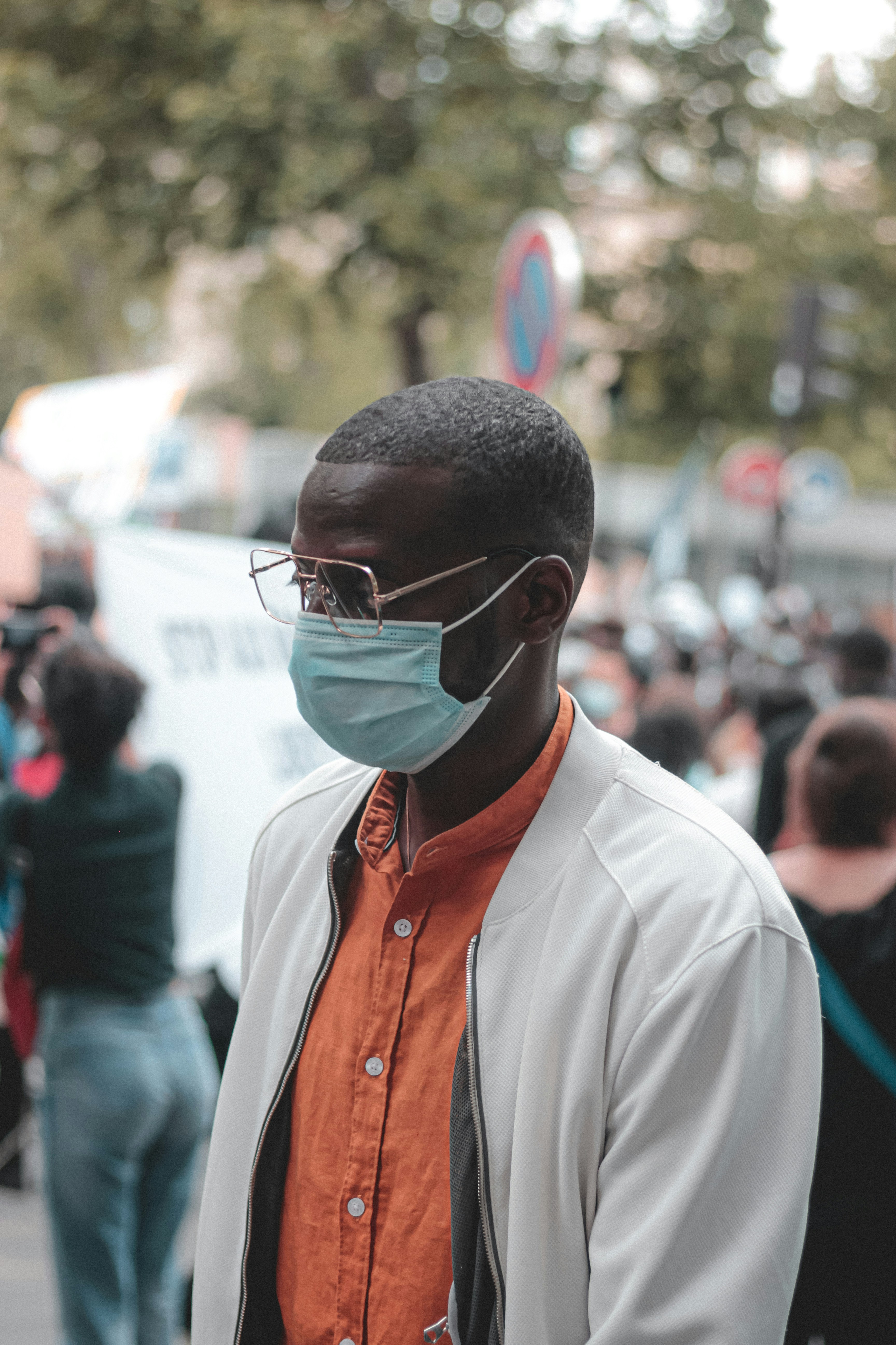 man in white button up shirt wearing black sunglasses