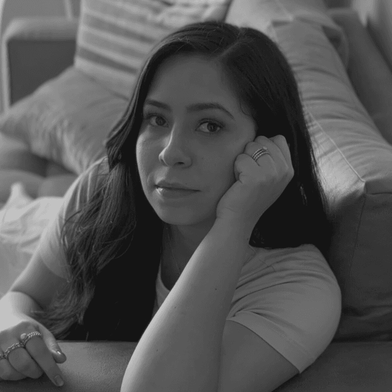 woman in white crew neck shirt smiling