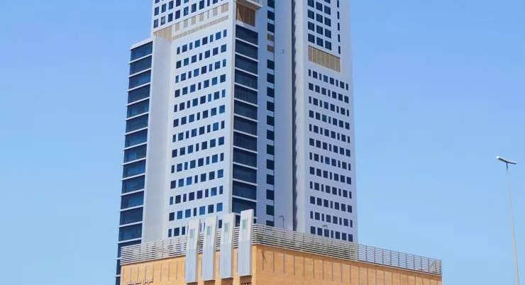 Side view of the modern Sidra Tower skyscraper against a clear blue sky, ideal for luxury office space.