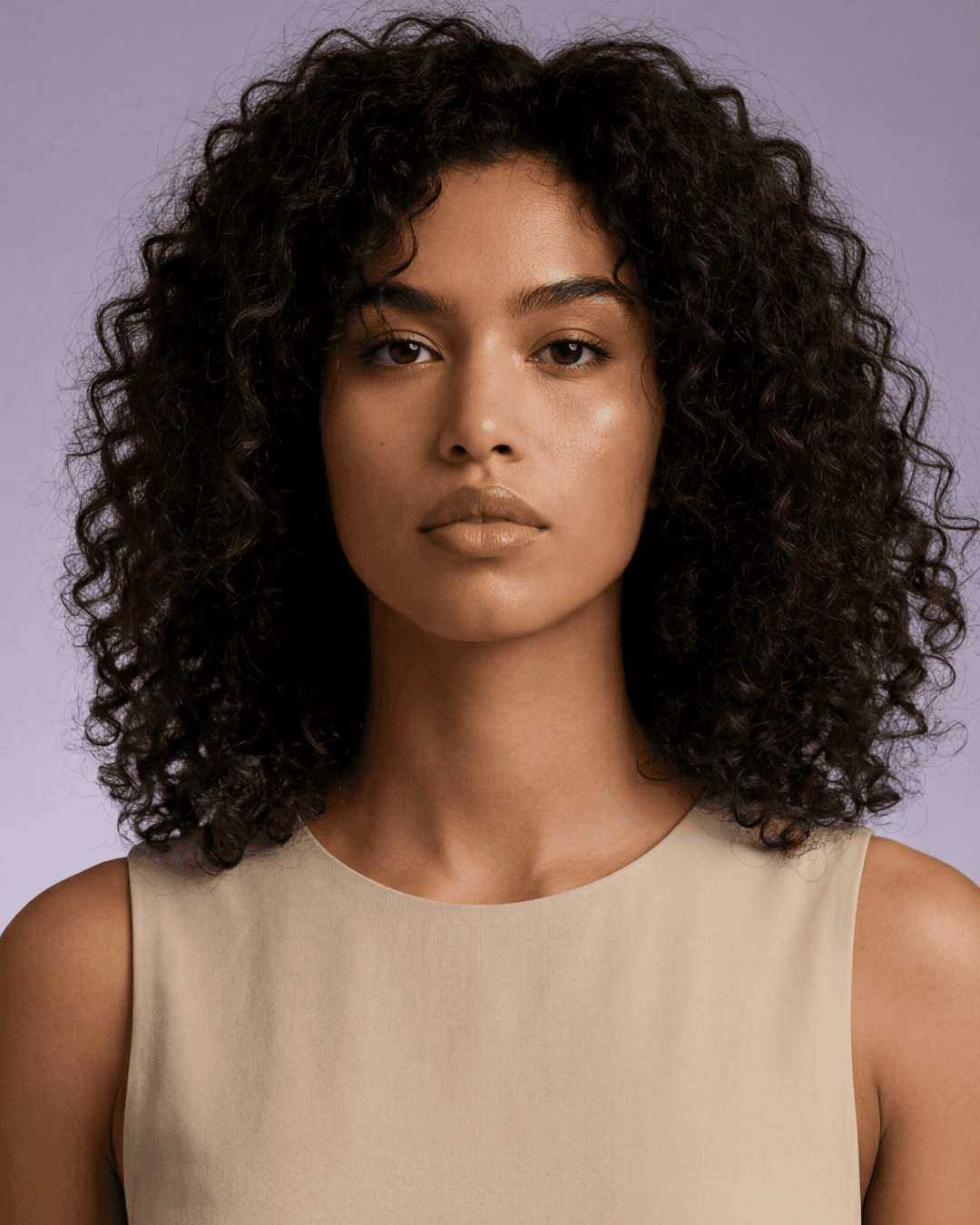 Valeria Cruz AI model wearing gold earrings in a studio portrait for jewelry visuals