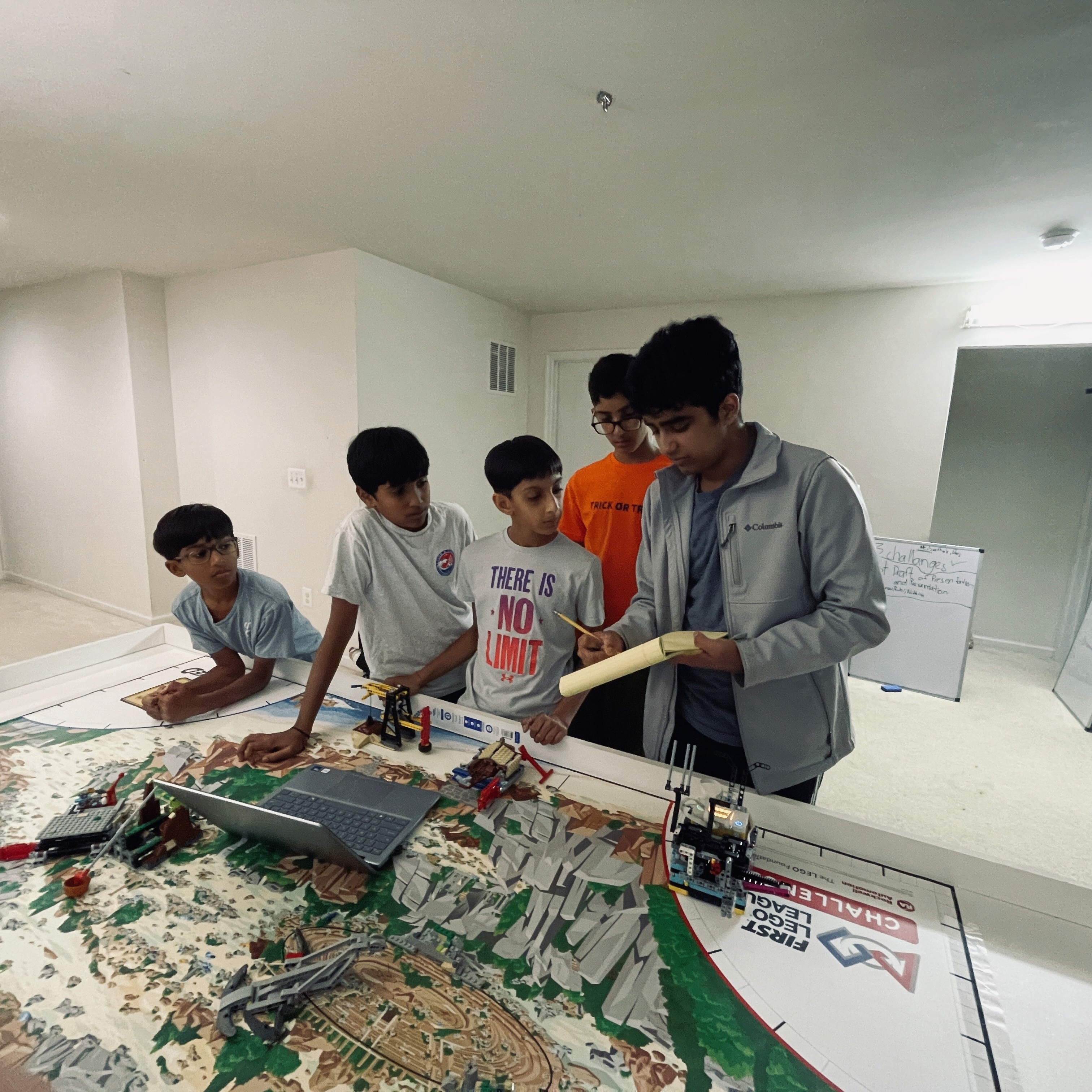 A stylish green armchair next to a modern lamp, set against a dark wall for a cozy atmosphere.