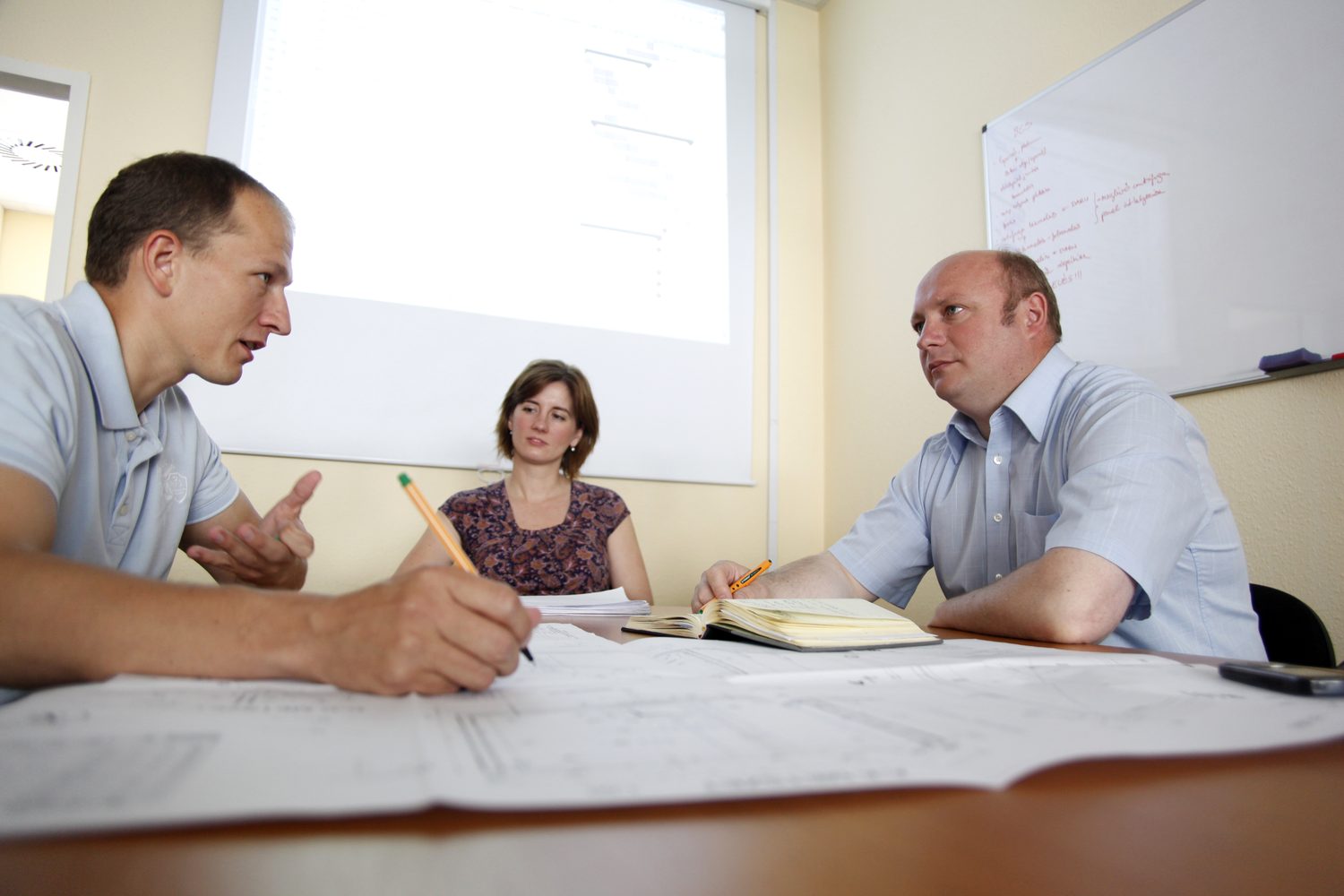 UTB consultants in a design review with a client's team