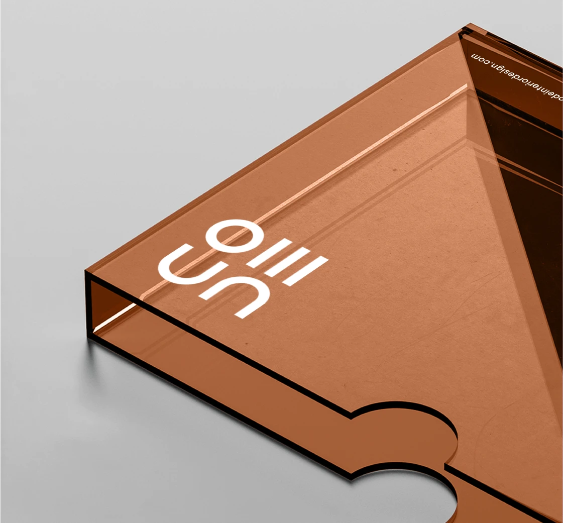 Transparent acrylic sign featuring the CODE logo in a warm brown tone.