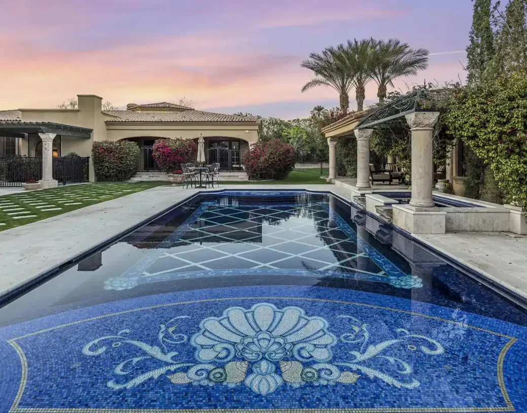 Beautiful mosaic pool featuring intricate Italian craftsmanship and vibrant blue tiles. Perfect for.