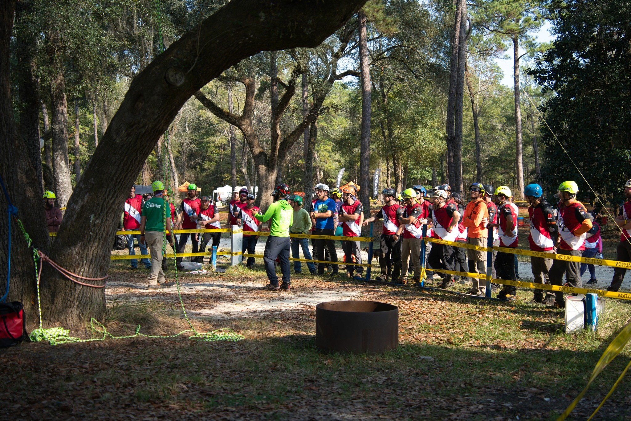 group of competitors and volunteers doing walk around with the judges for treeapalooza 2022 event