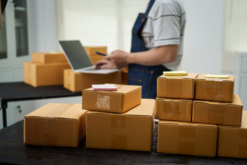 a man is working at his desk preparing parcel box 2026 01 08 07 53 58 utc