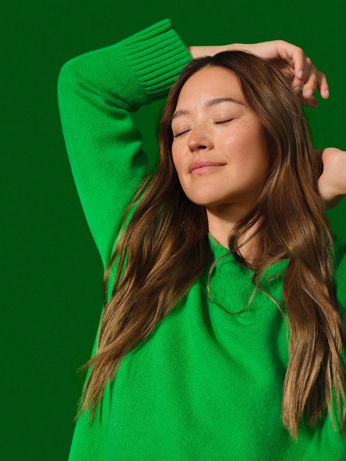 image of woman in green posing for a shoot 