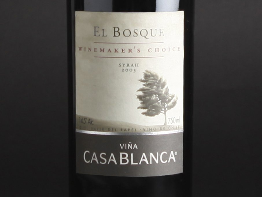 Rustic cabin in a golden field at sunset