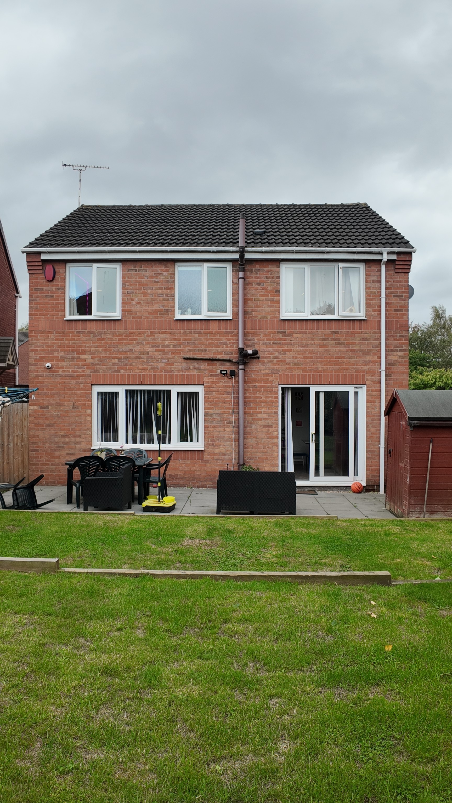 a young boy holding a box of food