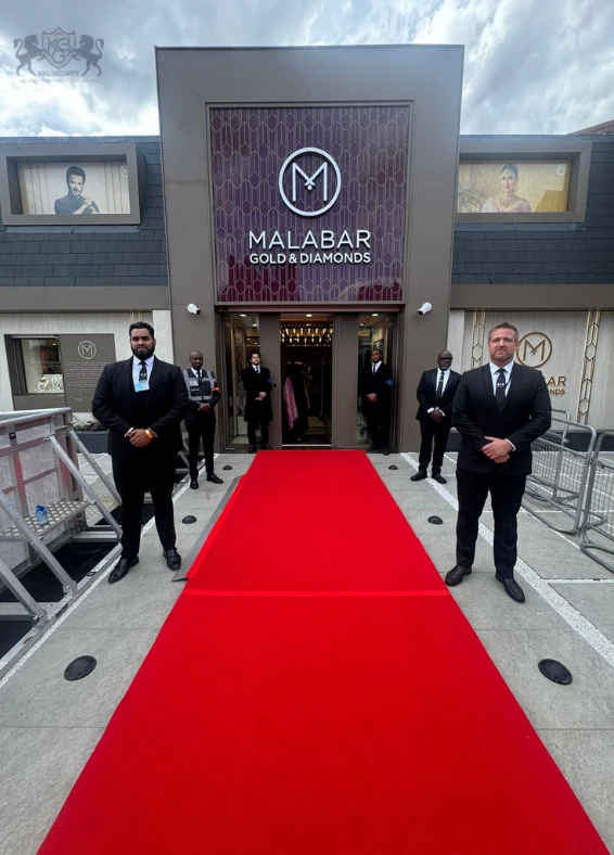 Security guards standing outside the entrance