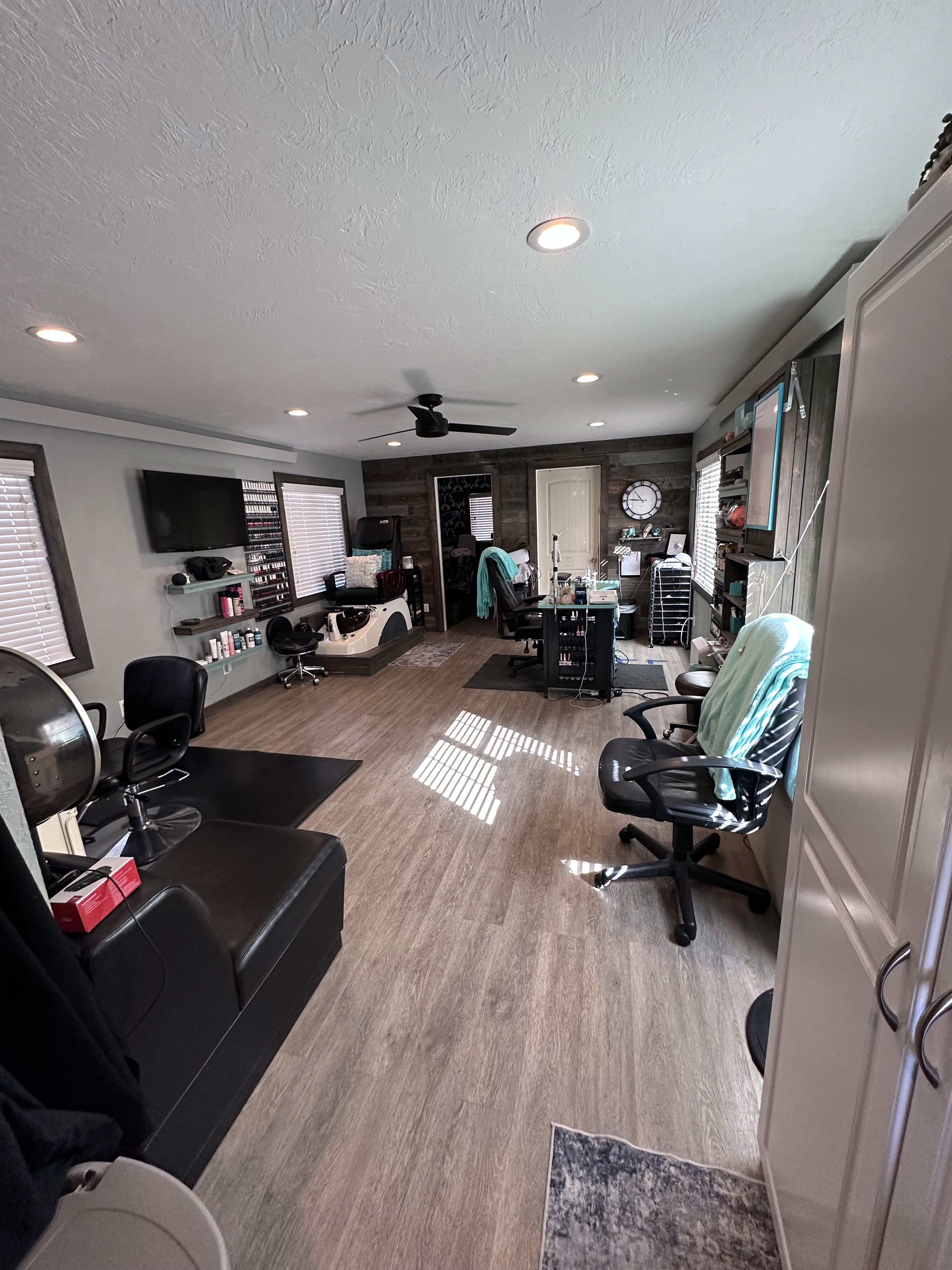 Hidden Look salon foyer in Star Valley, Wyoming with modern black and teal interior