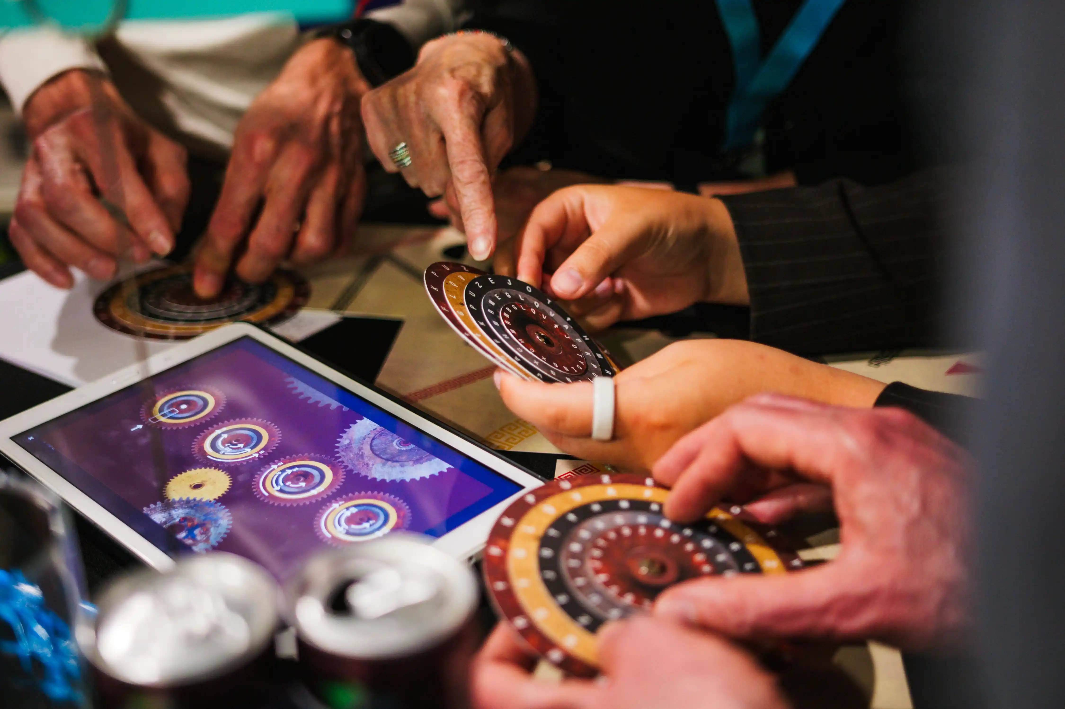 Participant turns a letter wheel during a team building activity of The Box Company