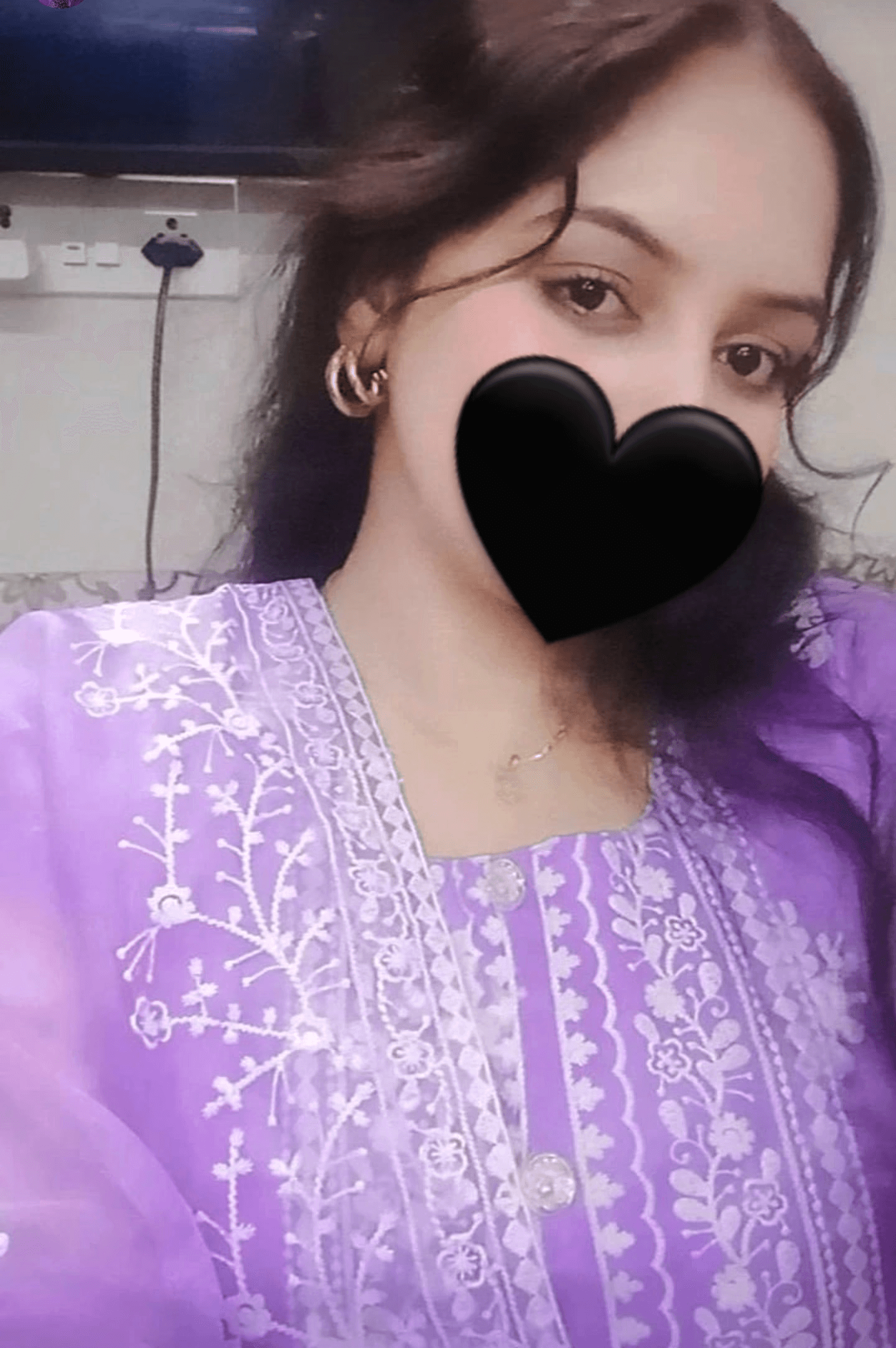 Close-up of a tree stump showing growth rings and a textured brown wood surface.