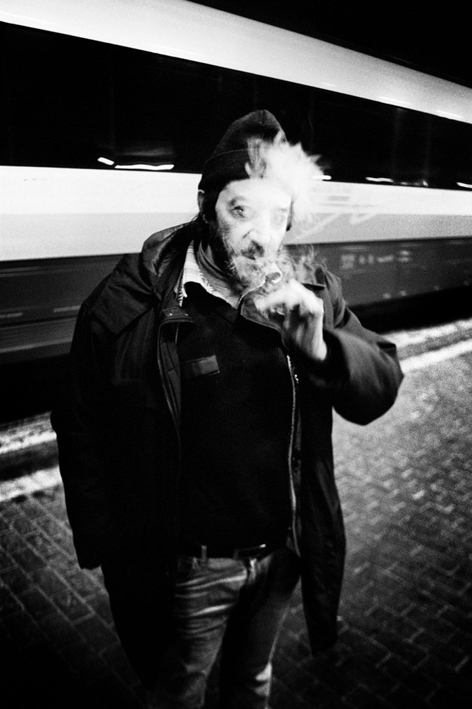 Palina – Soft Laziness – sitting on a white bed in a calm, sleepy pose