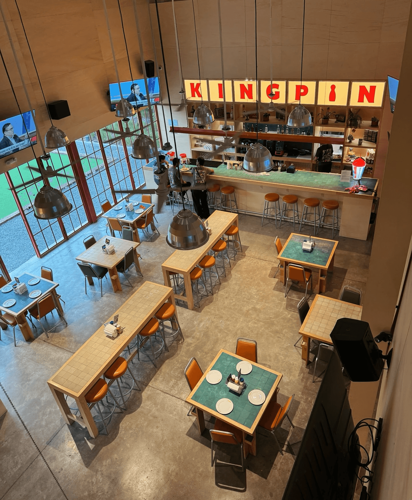 Wide view of the HitTrax Suite integrated into the Kingpin Social entertainment space.