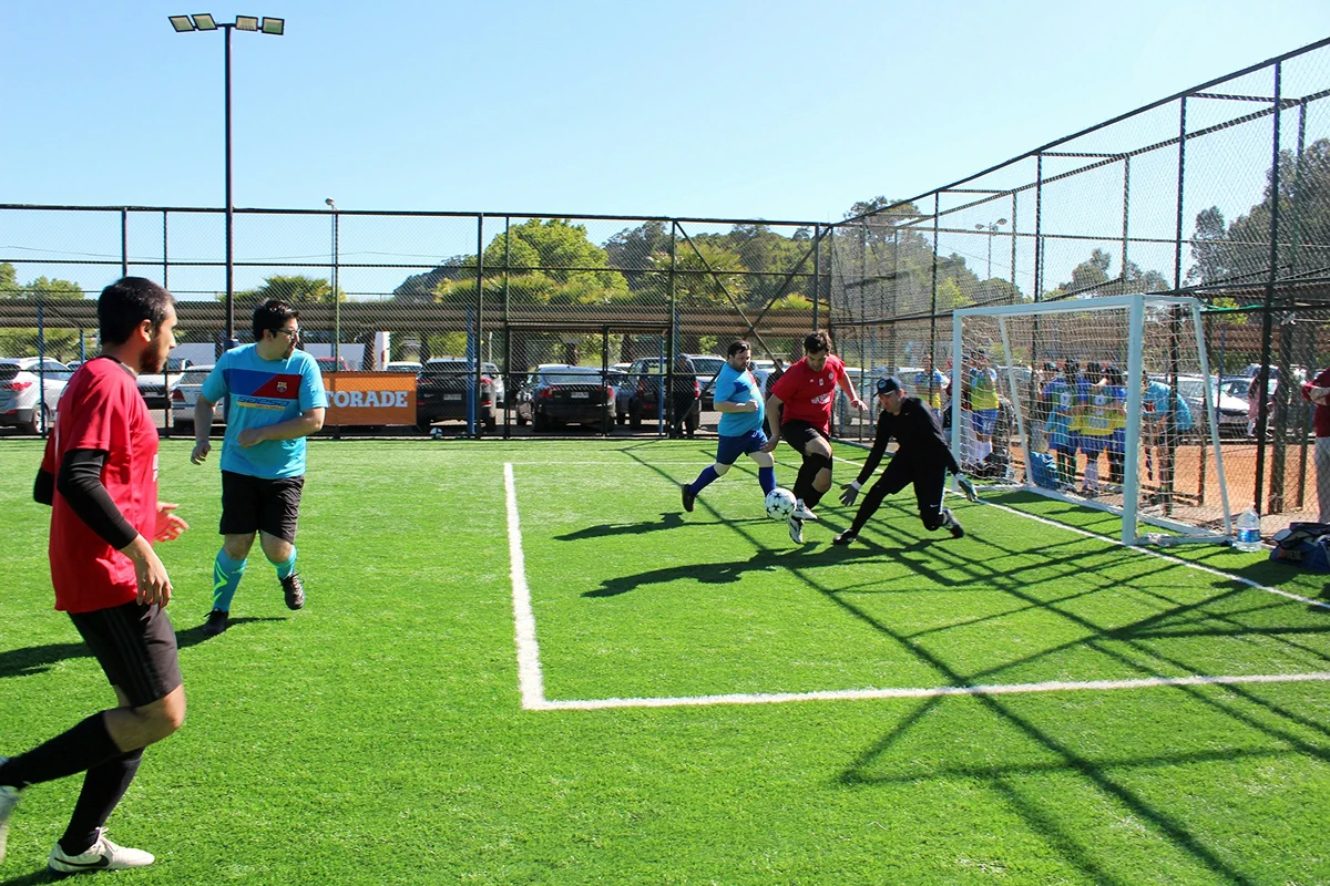 Players competing on an outdoor artificial-turf soccer field