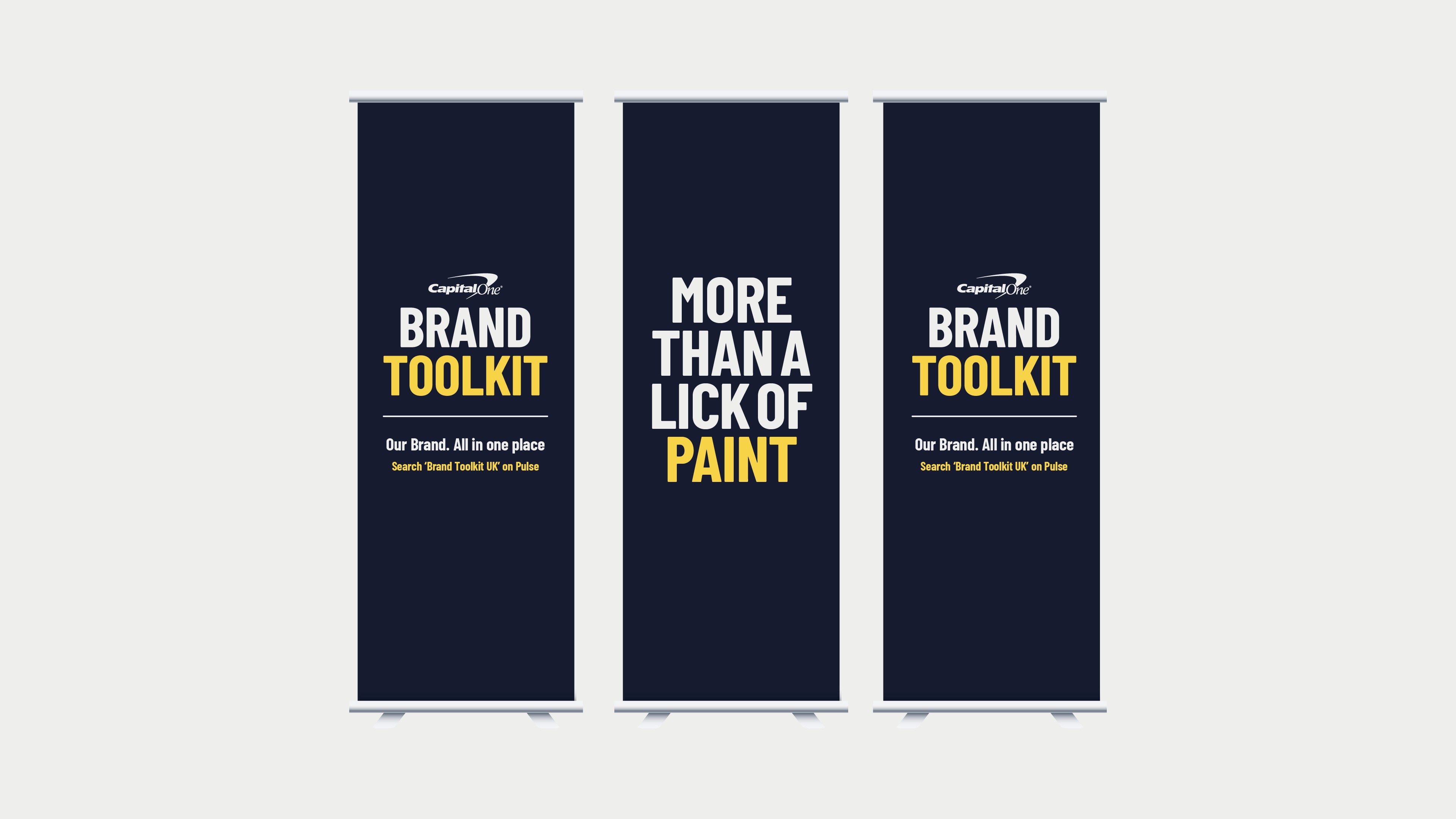 Modern home office setup with a monitor, ergonomic chair, keyboard, and indoor plants near a window with blinds.