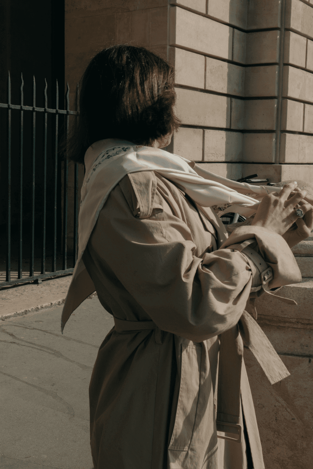 A group of people playing poker at a dimly lit bar table, with scattered cards and beers. The scene feels lively and social, focused on a man holding cards.