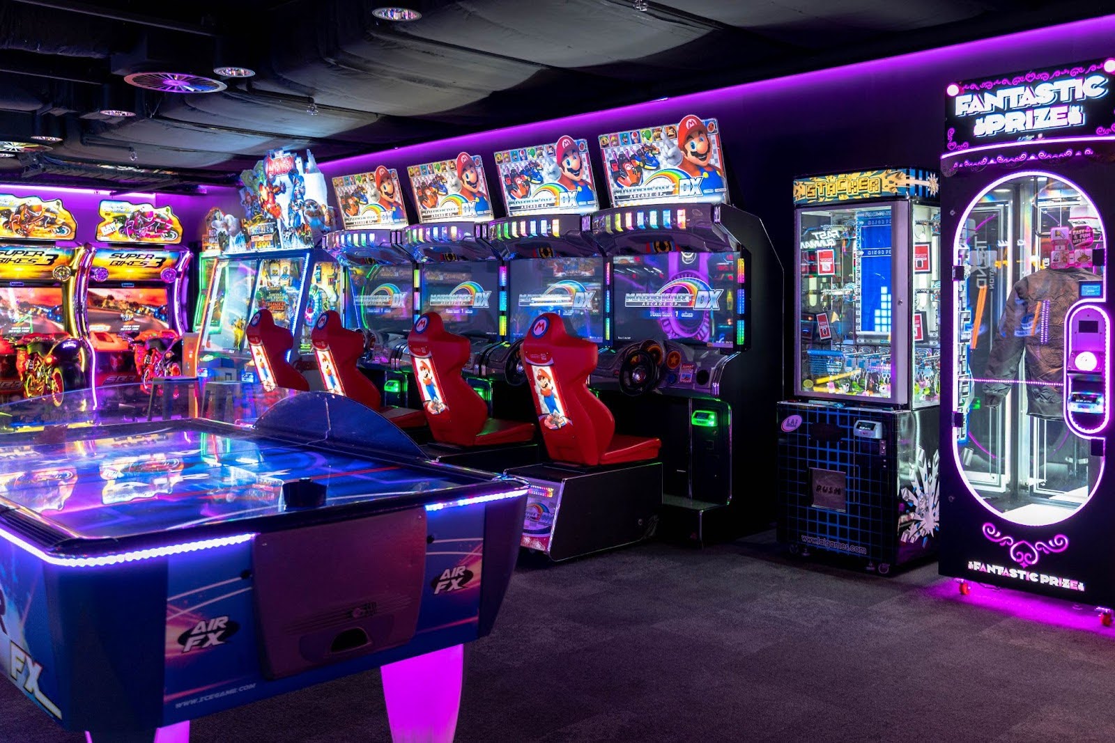 A young man playing on the Arcade machine in Fortress Sydney