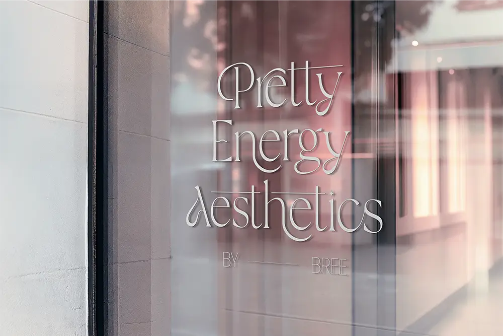 Pretty Energy Aesthetics logo on a shopfront window