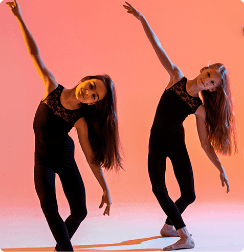 Students performing expressive contemporary dance choreography in after school performing arts program