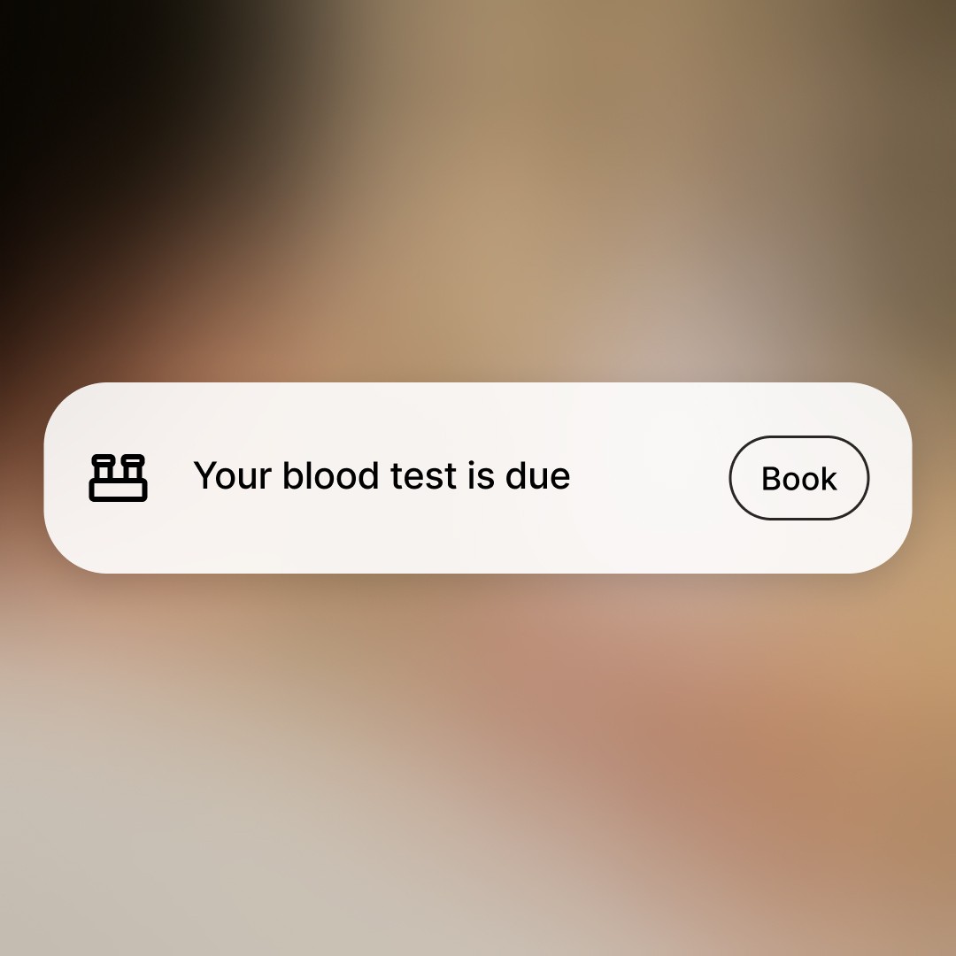 a gloved hand holding a test tube filled with liquid