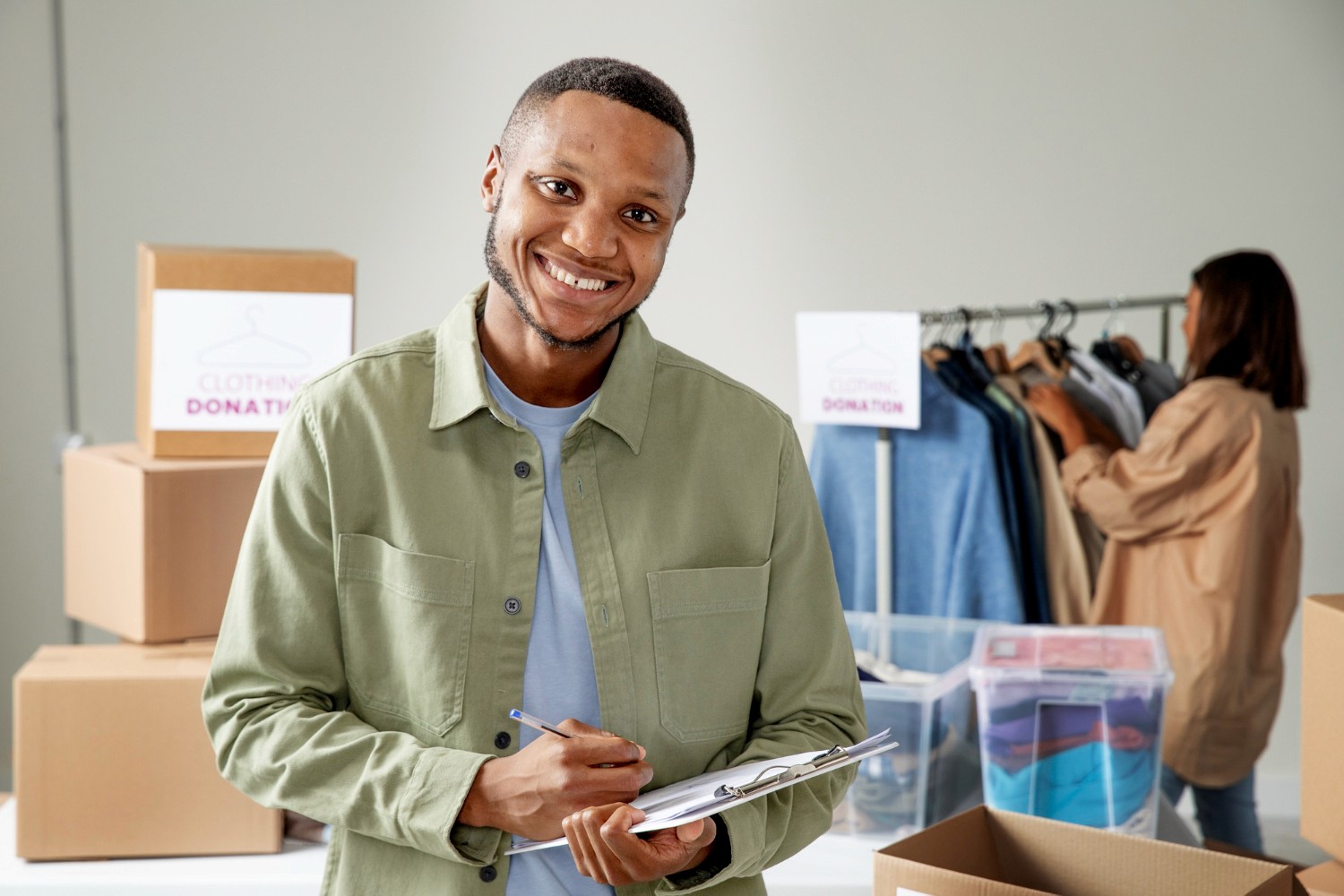 woman holding a phone and man looking at the phone. both are smiling