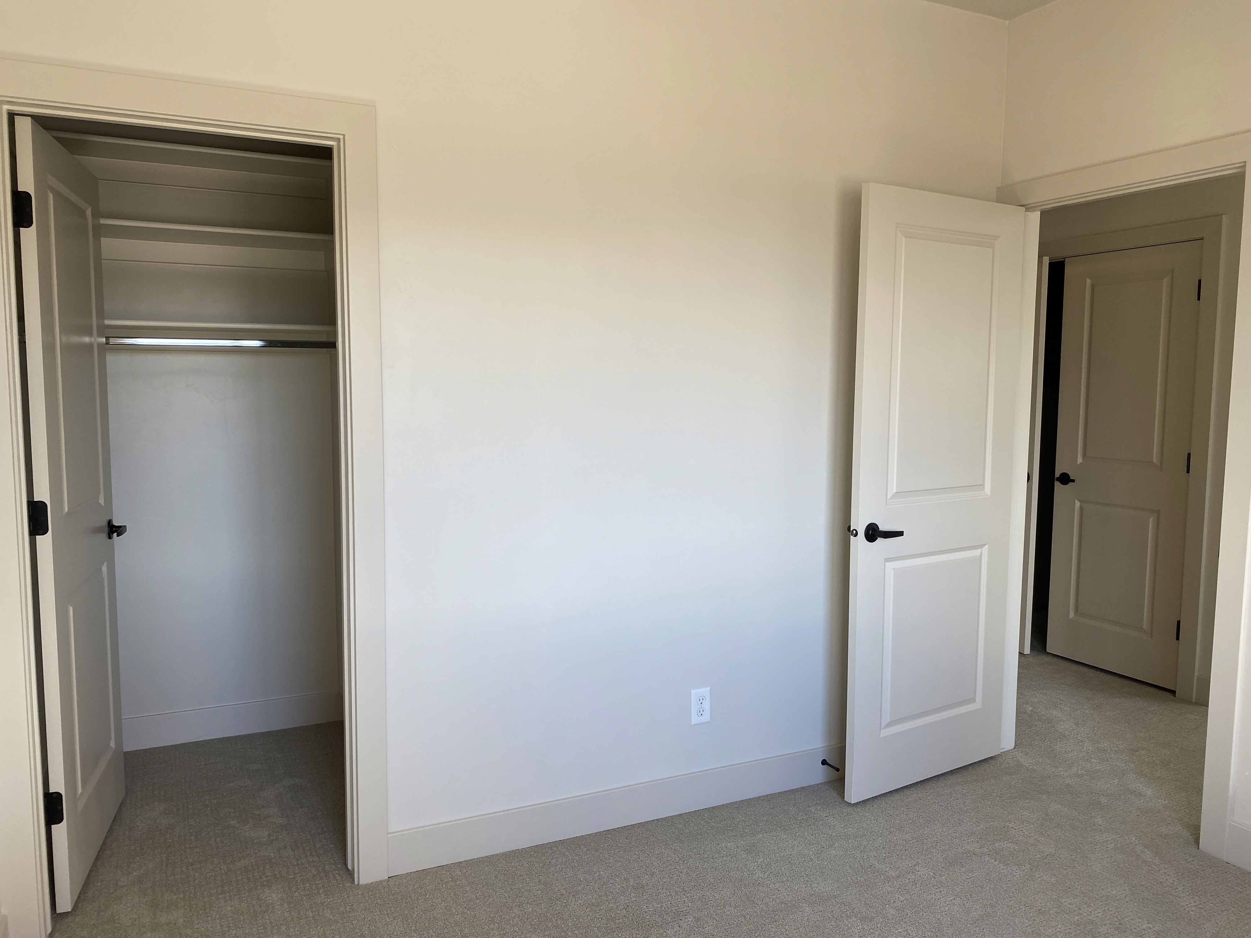 Guest bedroom in a Southern Utah duplex designed for everyday living.