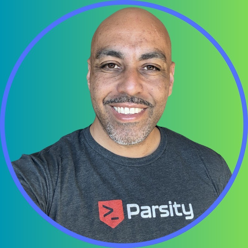 A person on a cozy studio smiling