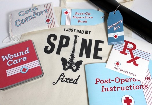 a handbag with a spine illustration and miscellaneous parts of the aid kit