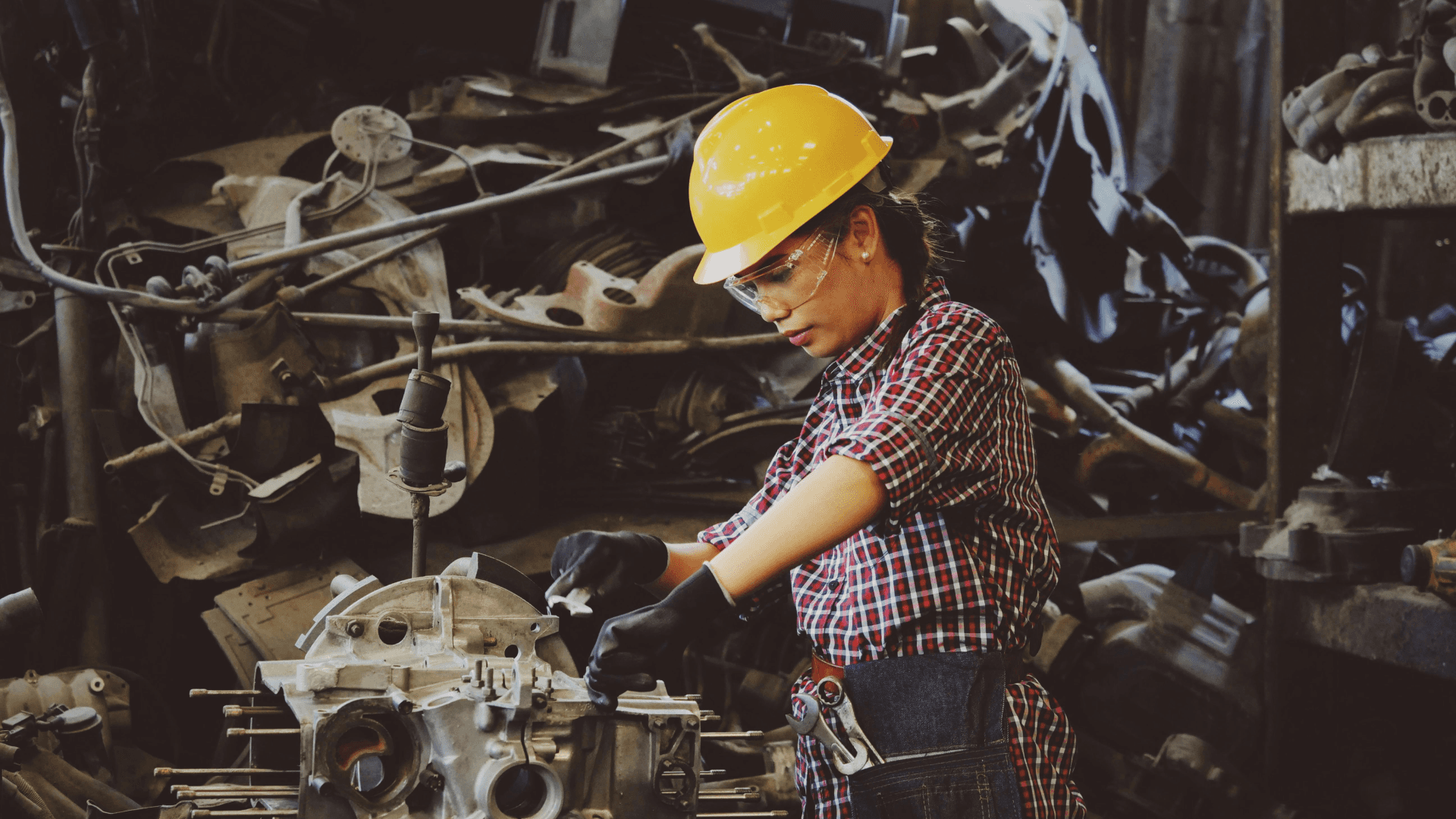 Engineer performing hands-on maintenance in an industrial facility, highlighting the shift from reactive repairs to AI-powered predictive maintenance