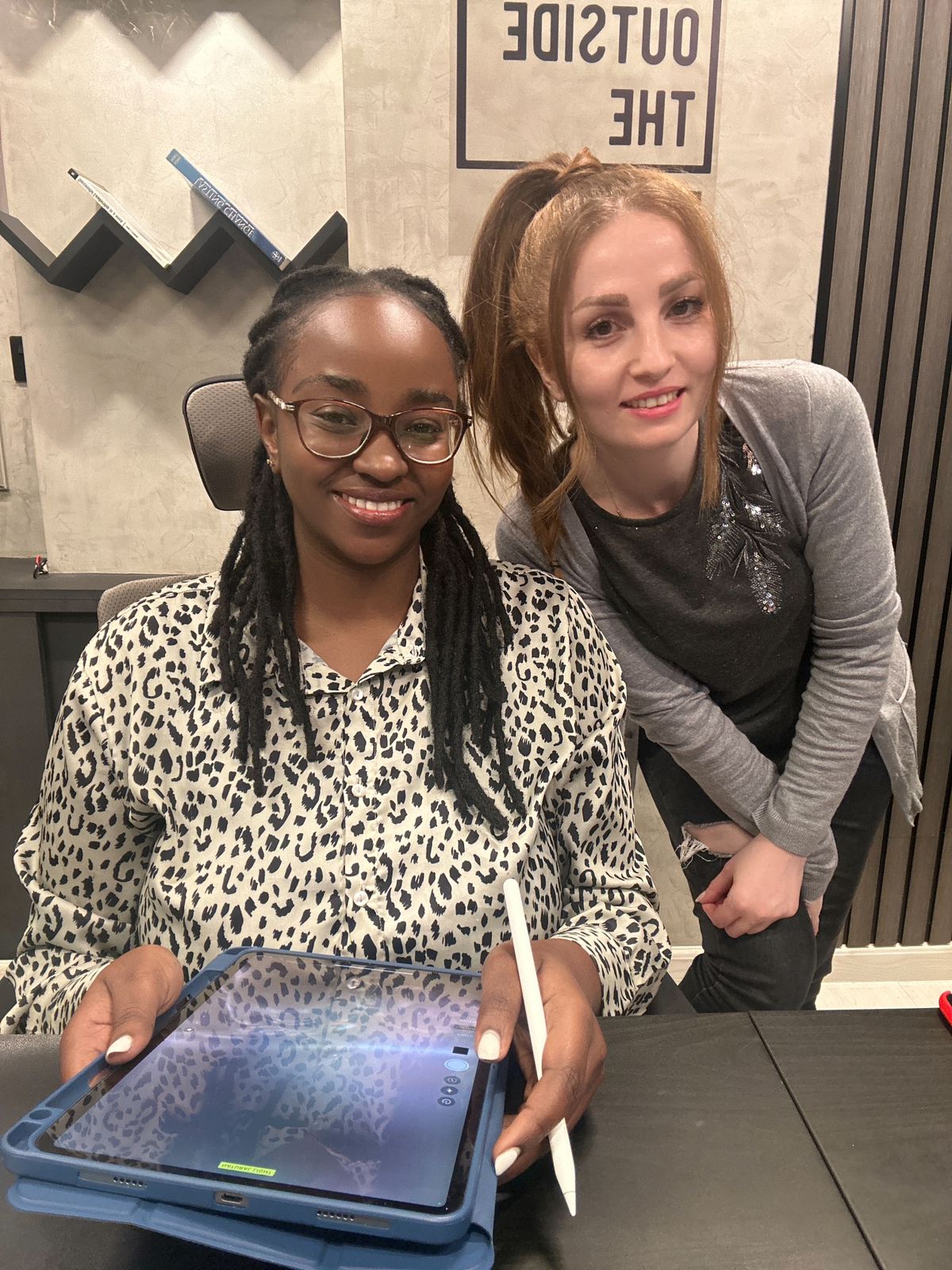 Jane at the office with a teammate