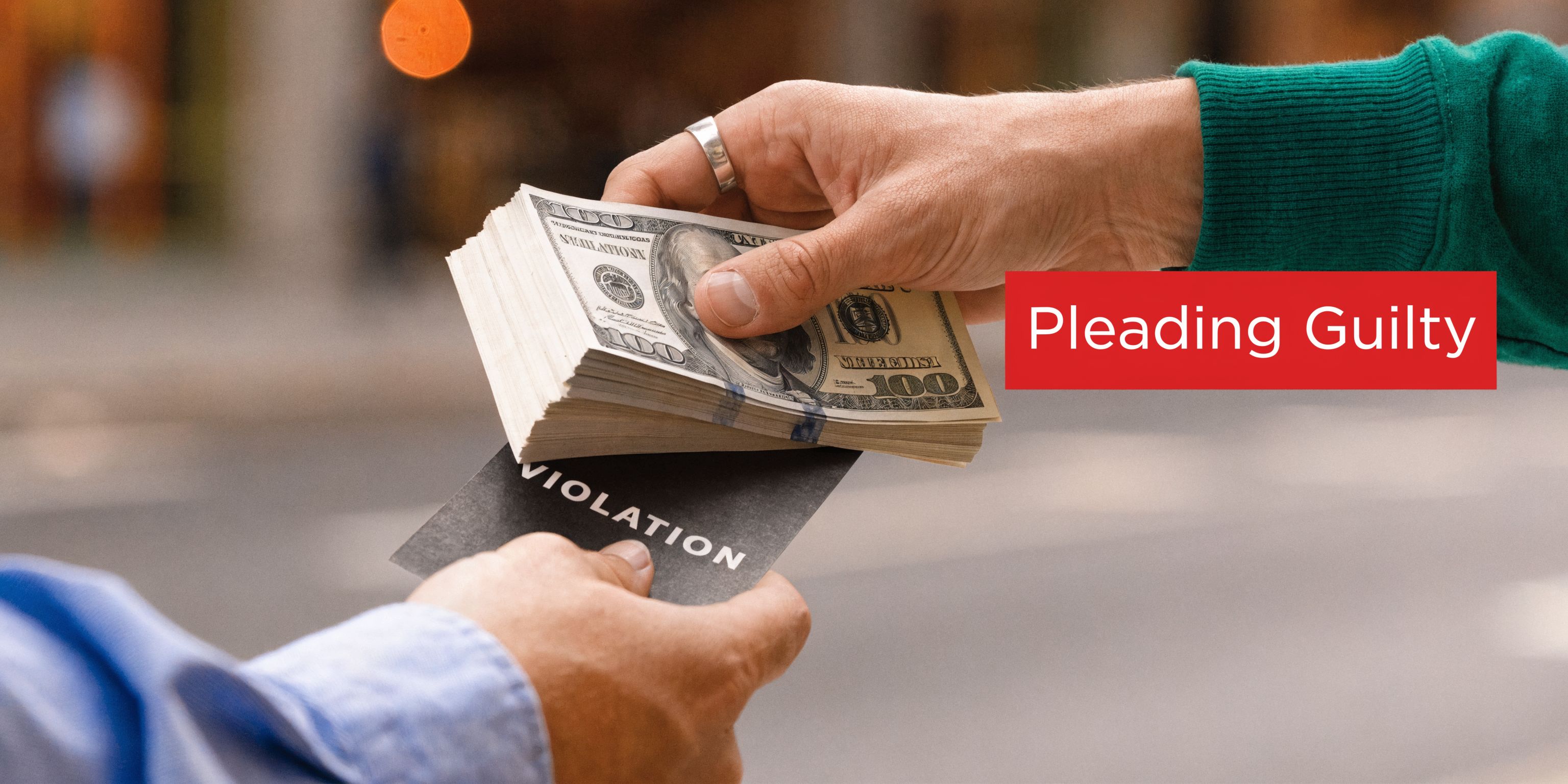A close-up shot of a hand offering a stack of cash to someone holding a violation ticket.