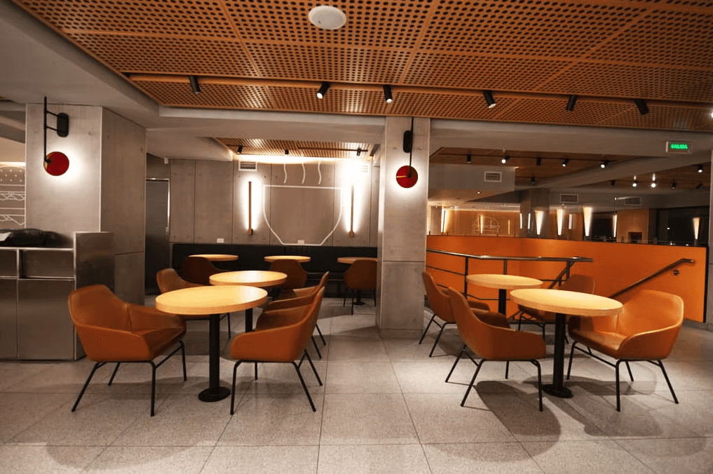 brown wooden chairs and table near glass window