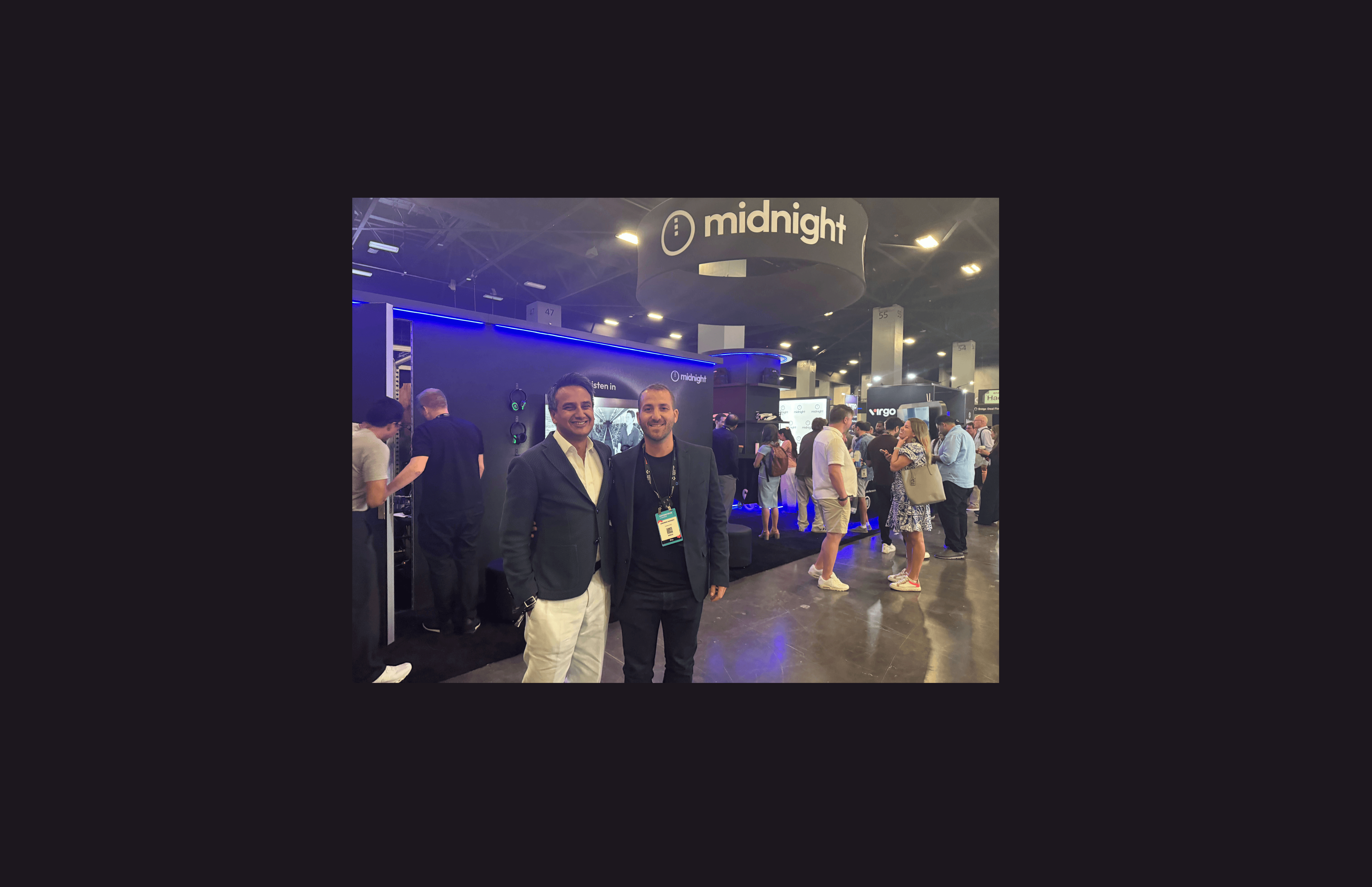 Fahmi Syed President of the Midnight Foundation and Andrew Kamsky of Coinjuice at the Midnight booth Consensus Miami 2026