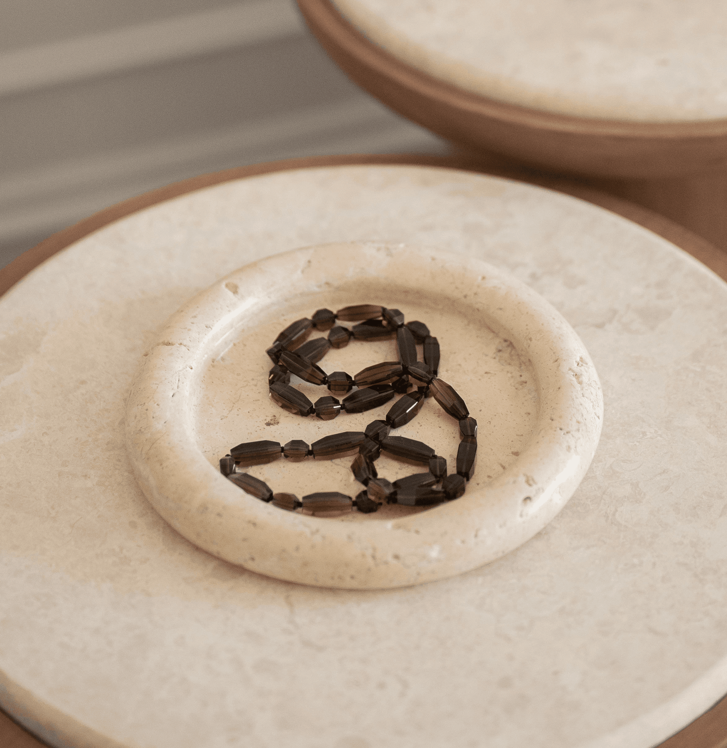 A scene of a ceramic plate with two pears on it