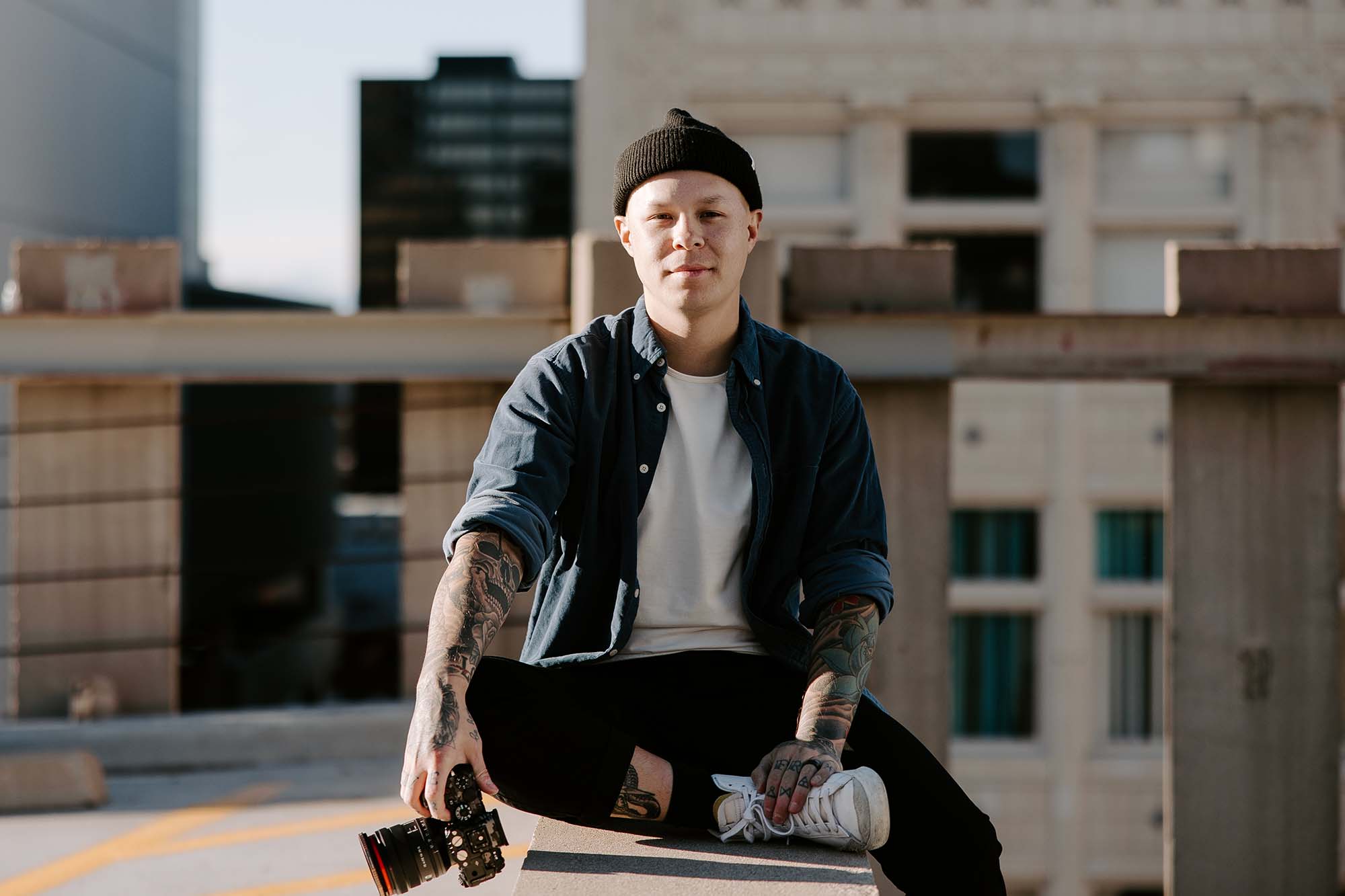 Jason Luong sitting while holding a Sony A7S3