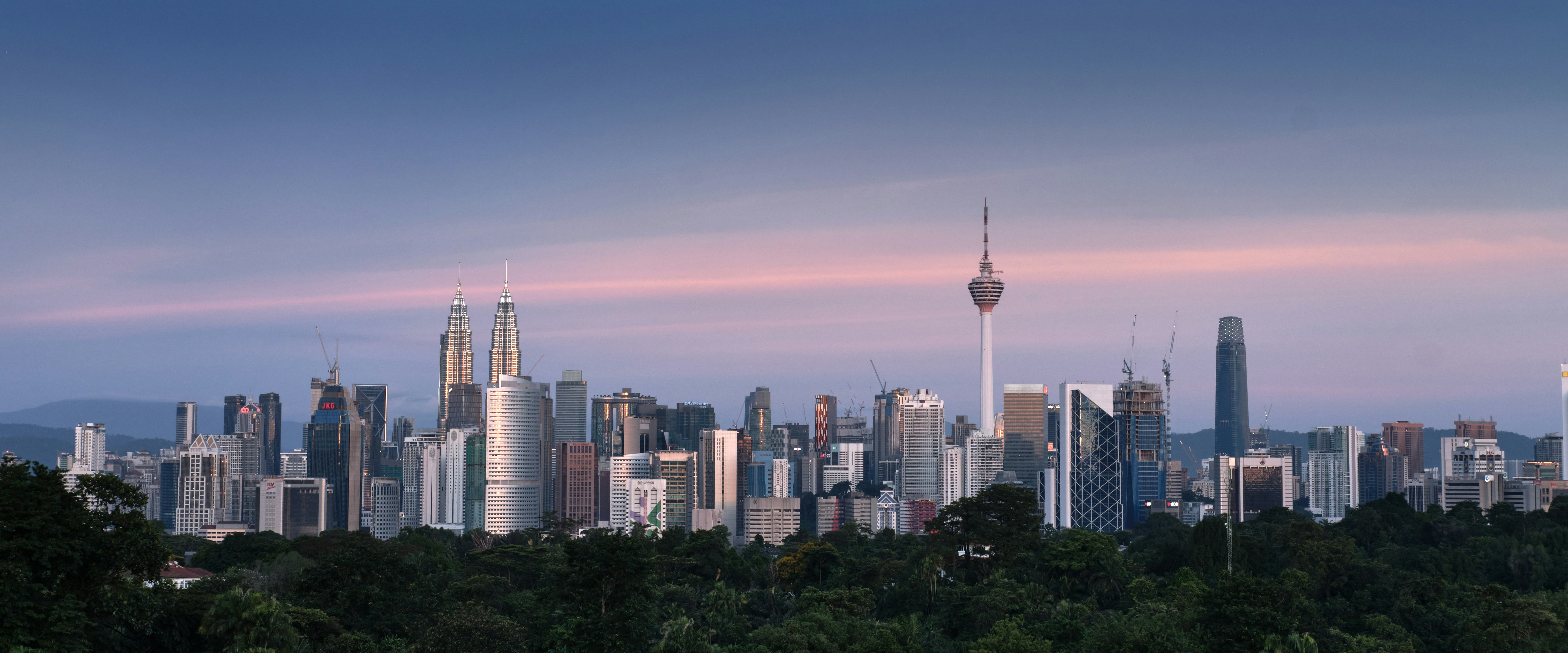 city skyline under blue sky during daytime