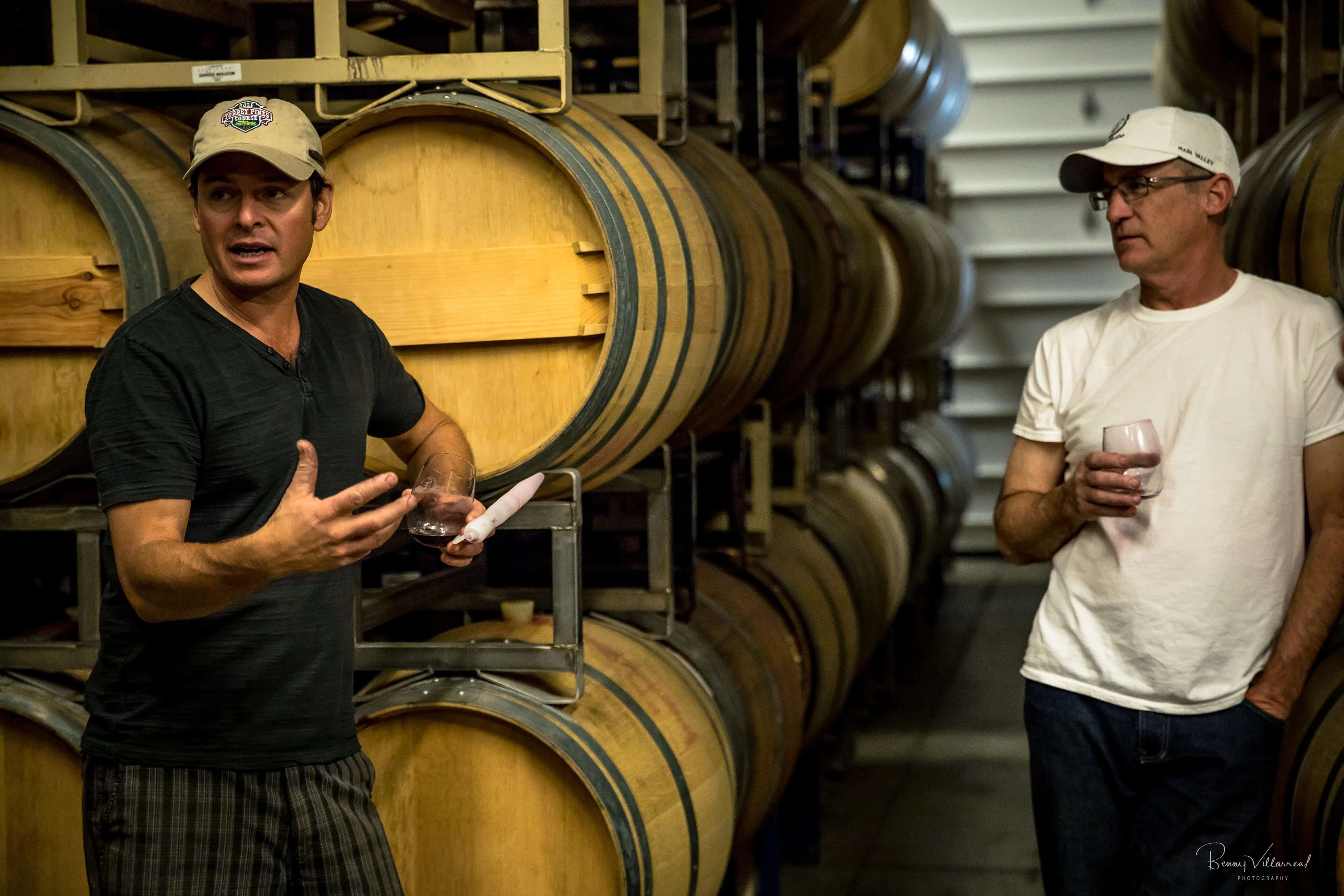 Rudy explaining wine process in a cellar