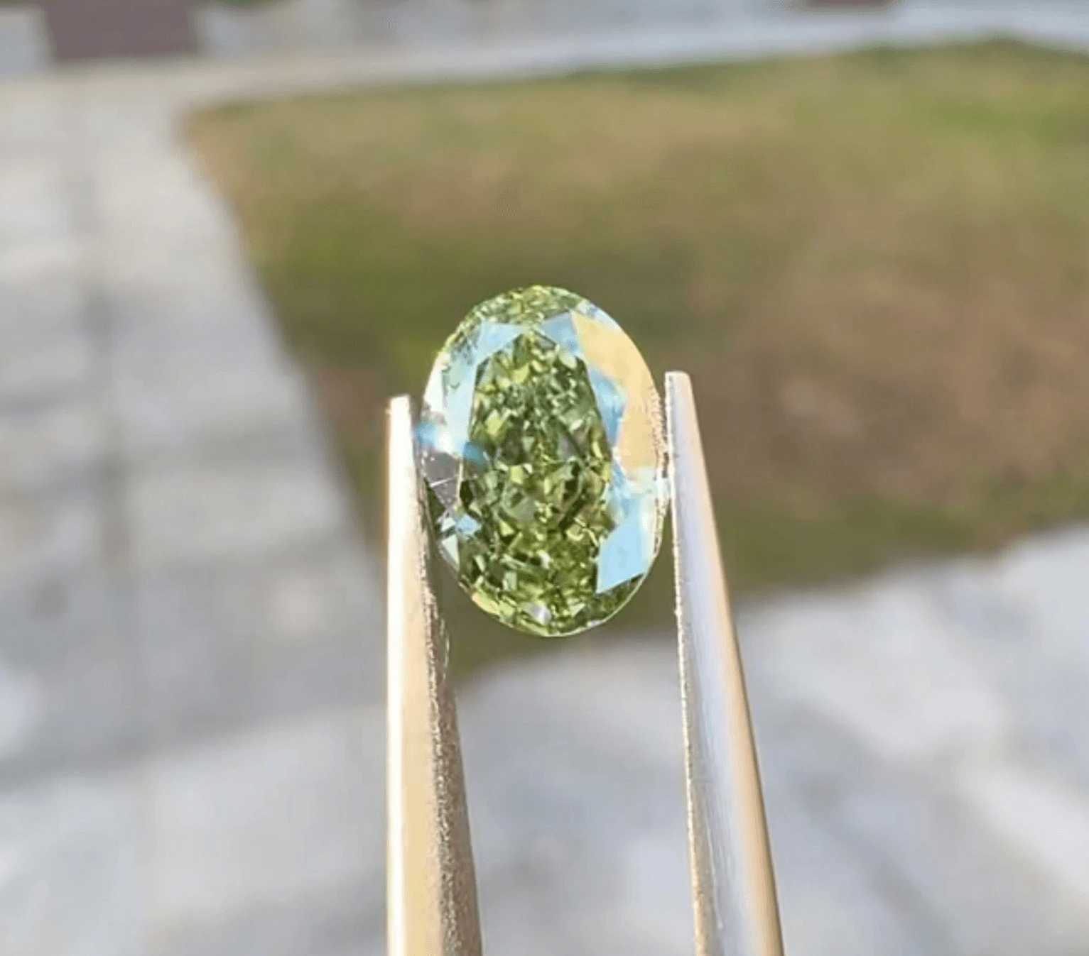 Green lab-grown diamond in an Oval Cut.