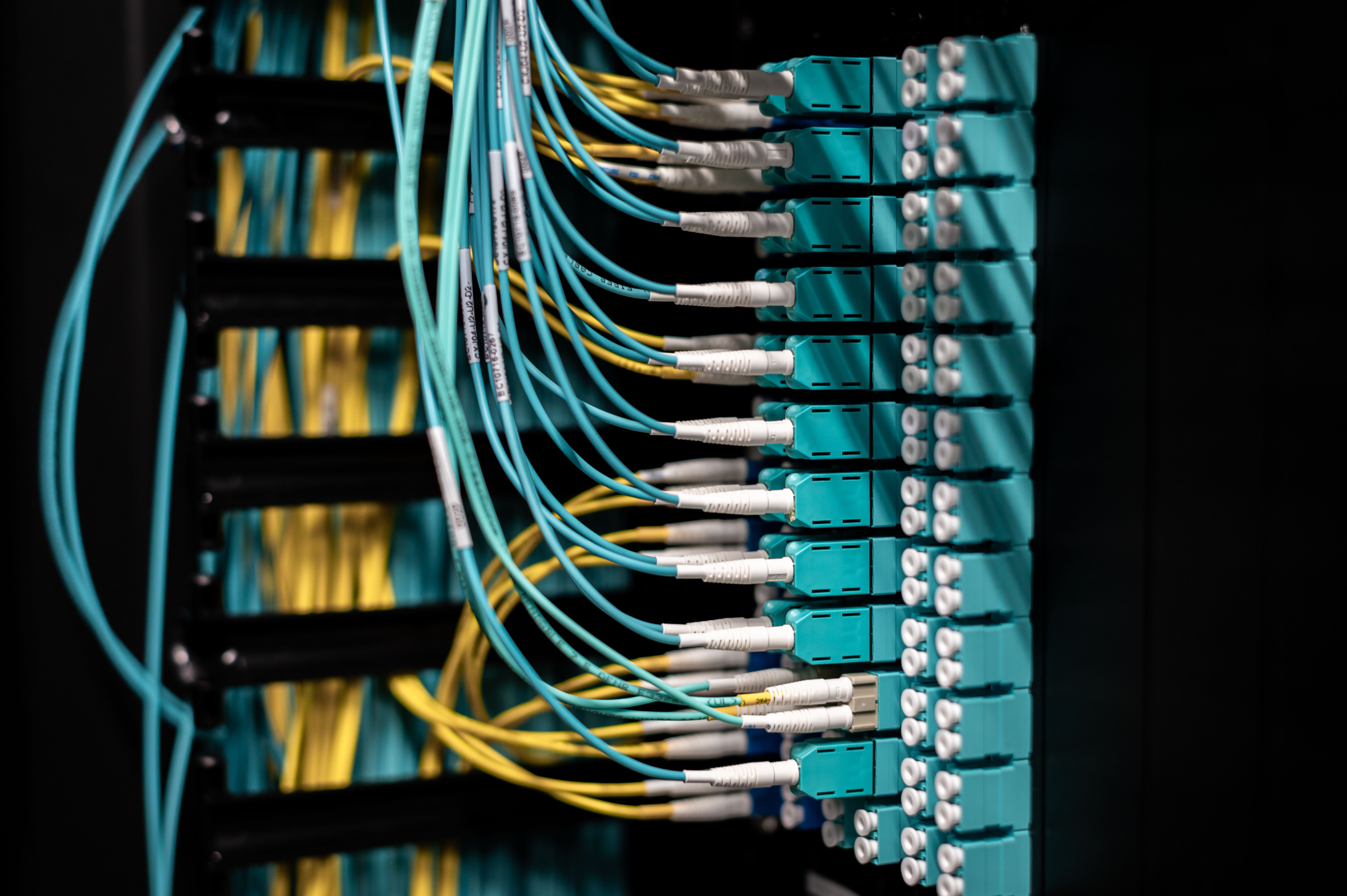 closeup-of-switch-in-server-with-connectors-and-adapters-connected-to-plastic-de - brett-sayles (pexels)